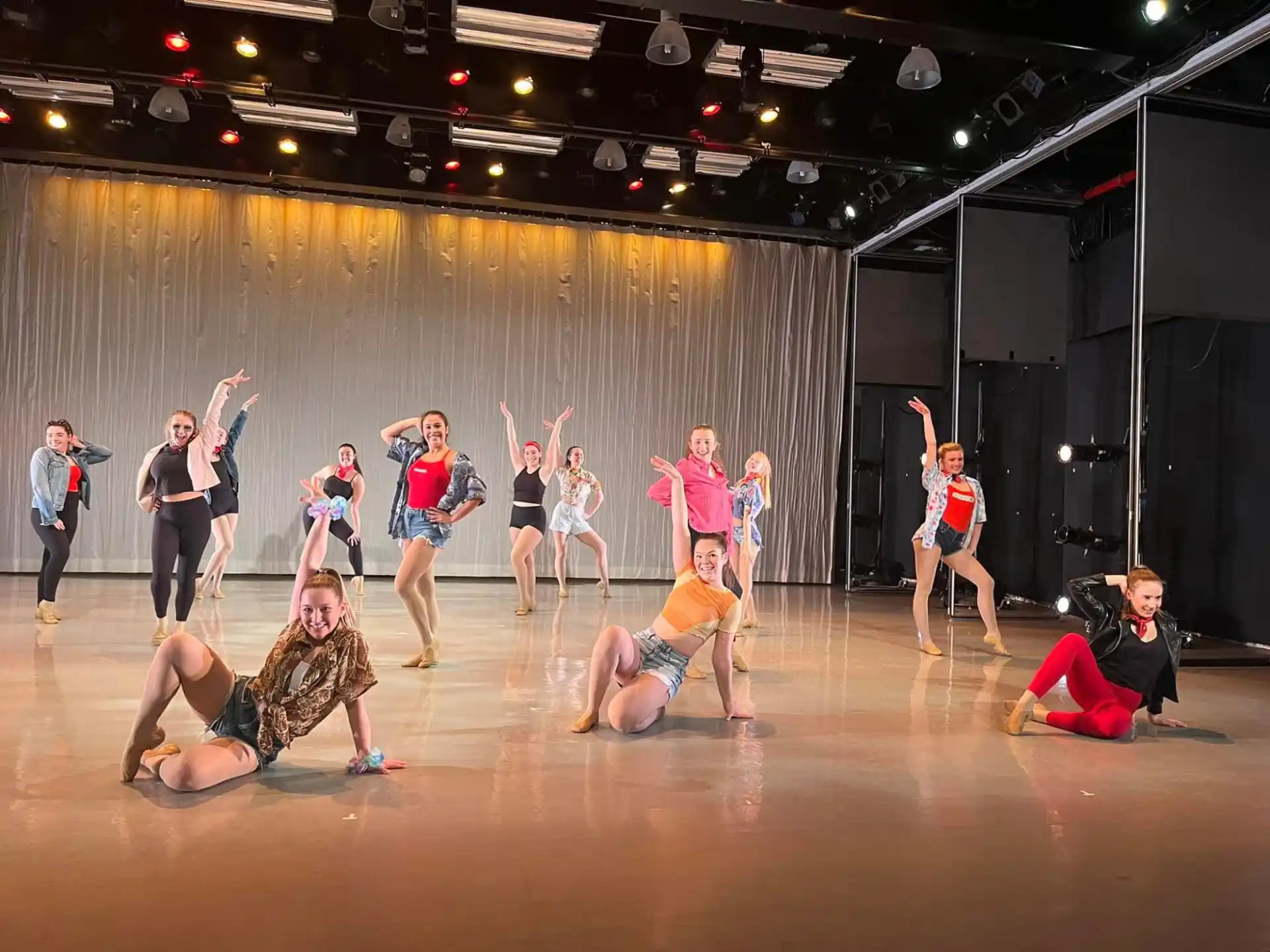 a group of people dancing on a stage