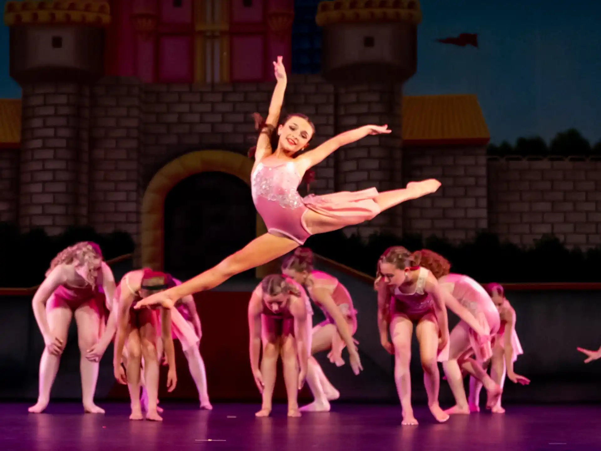 a group of children performing on a stage