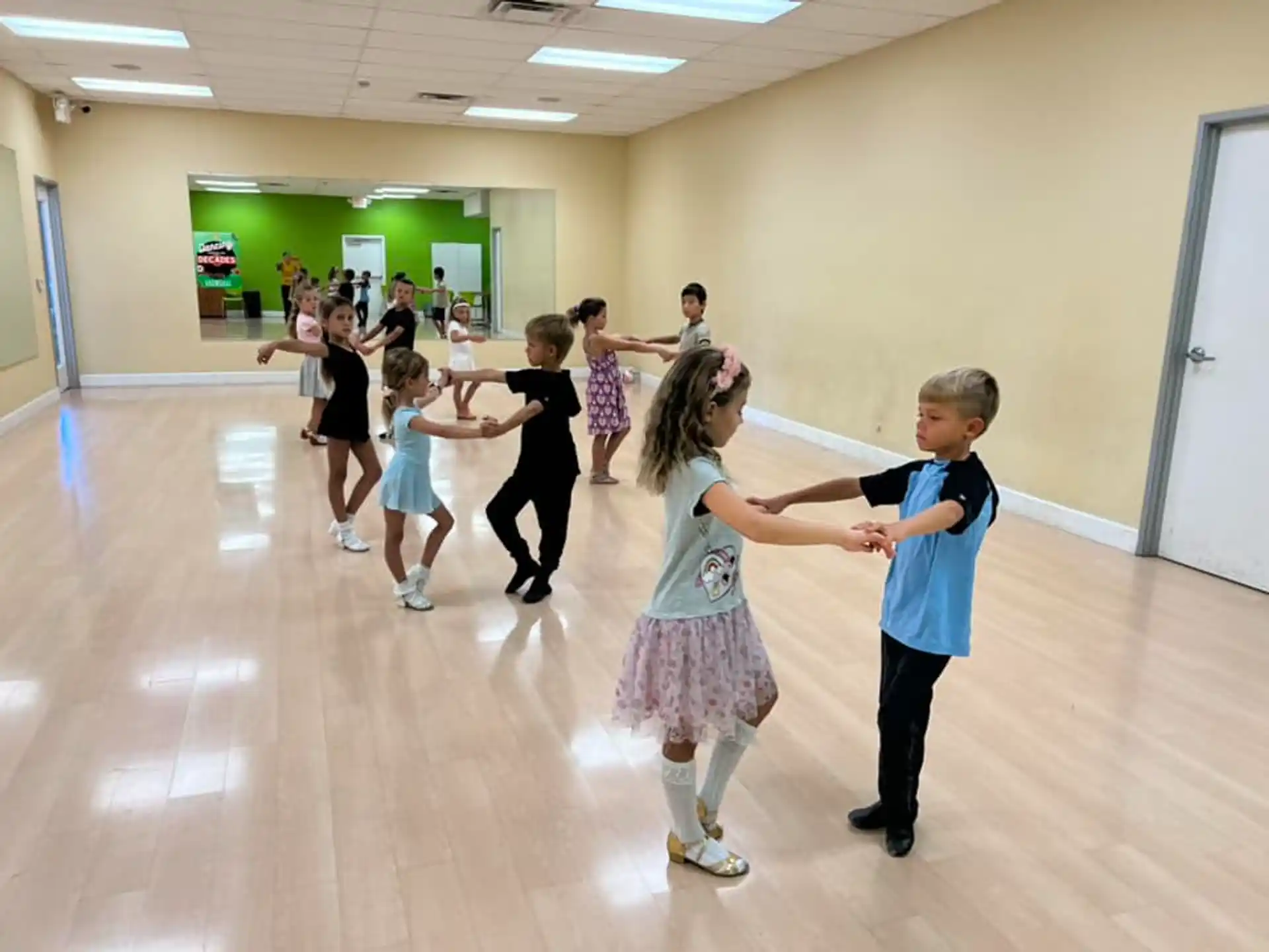 a group of children dancing in a room