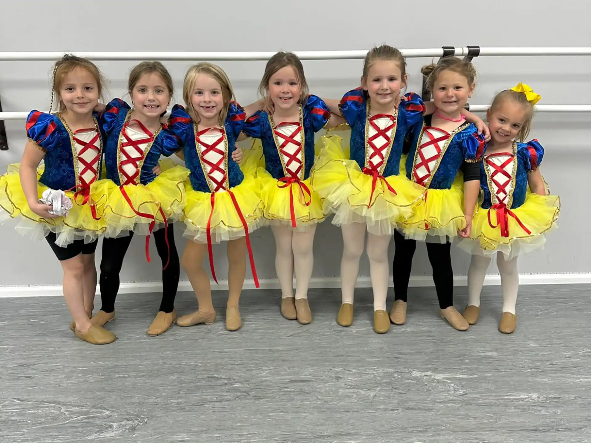 a group of children in matching outfits