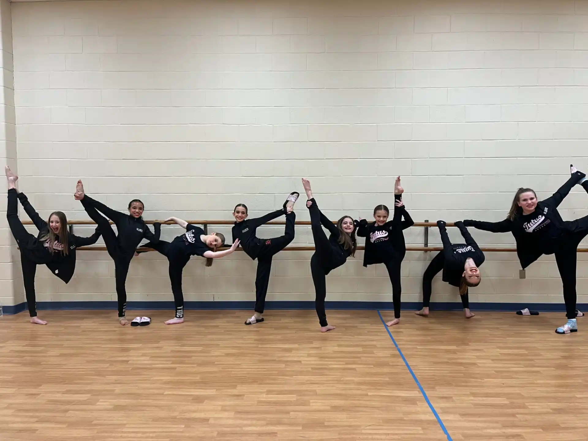 a group of women in black dancing