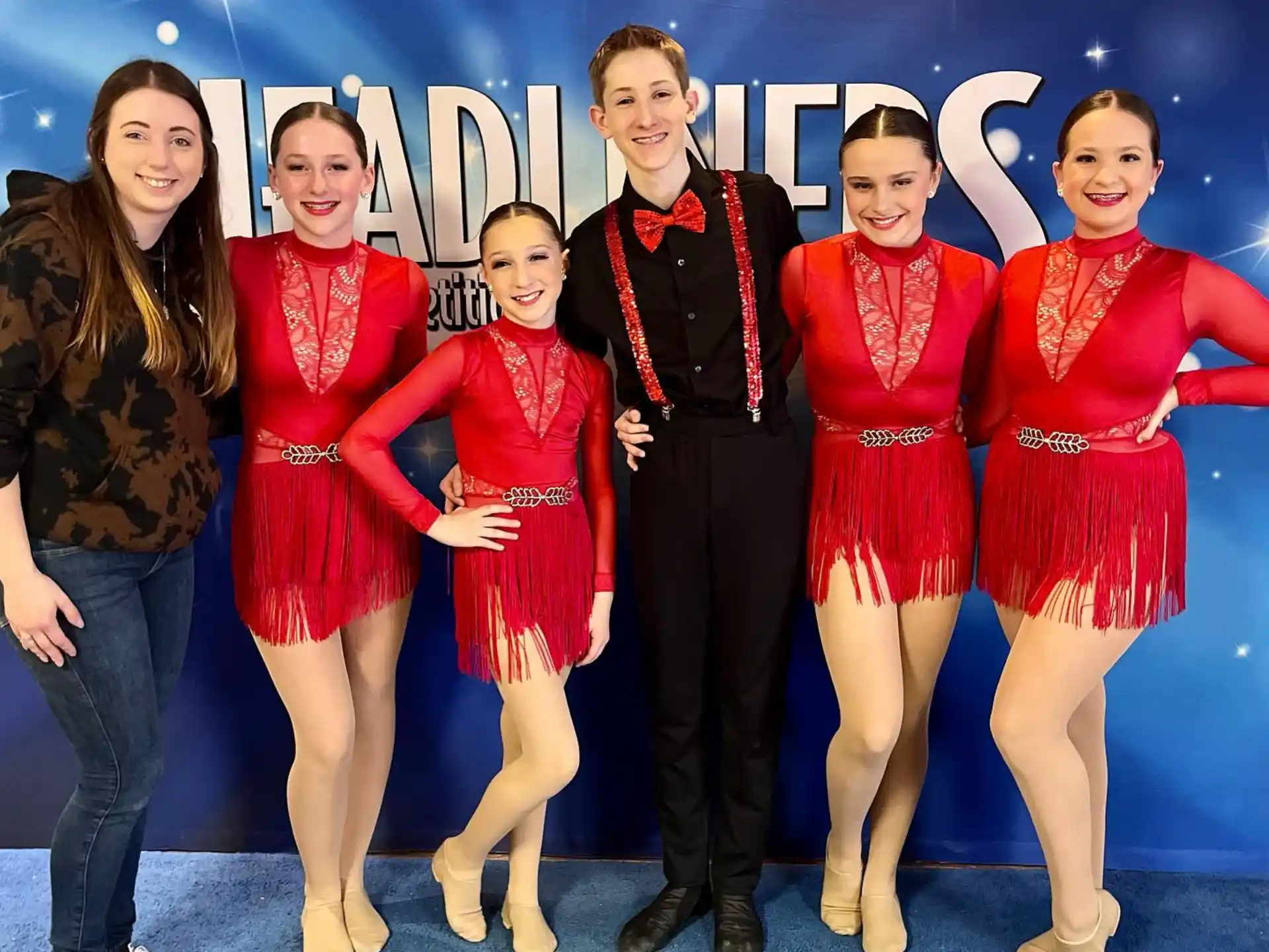 a group of women posing for a photo