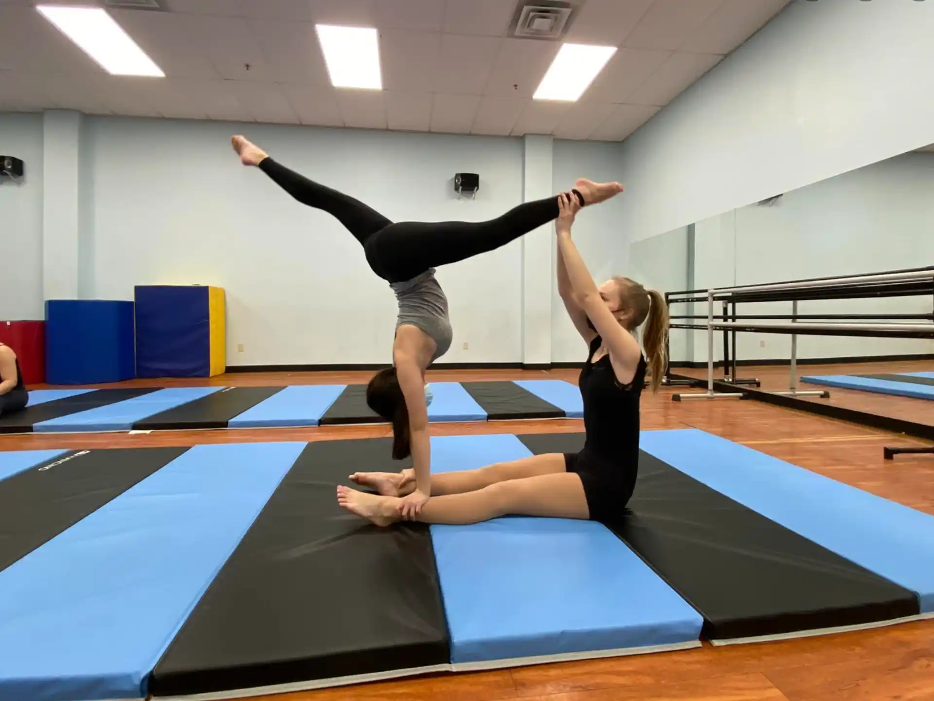 a couple of women doing yoga
