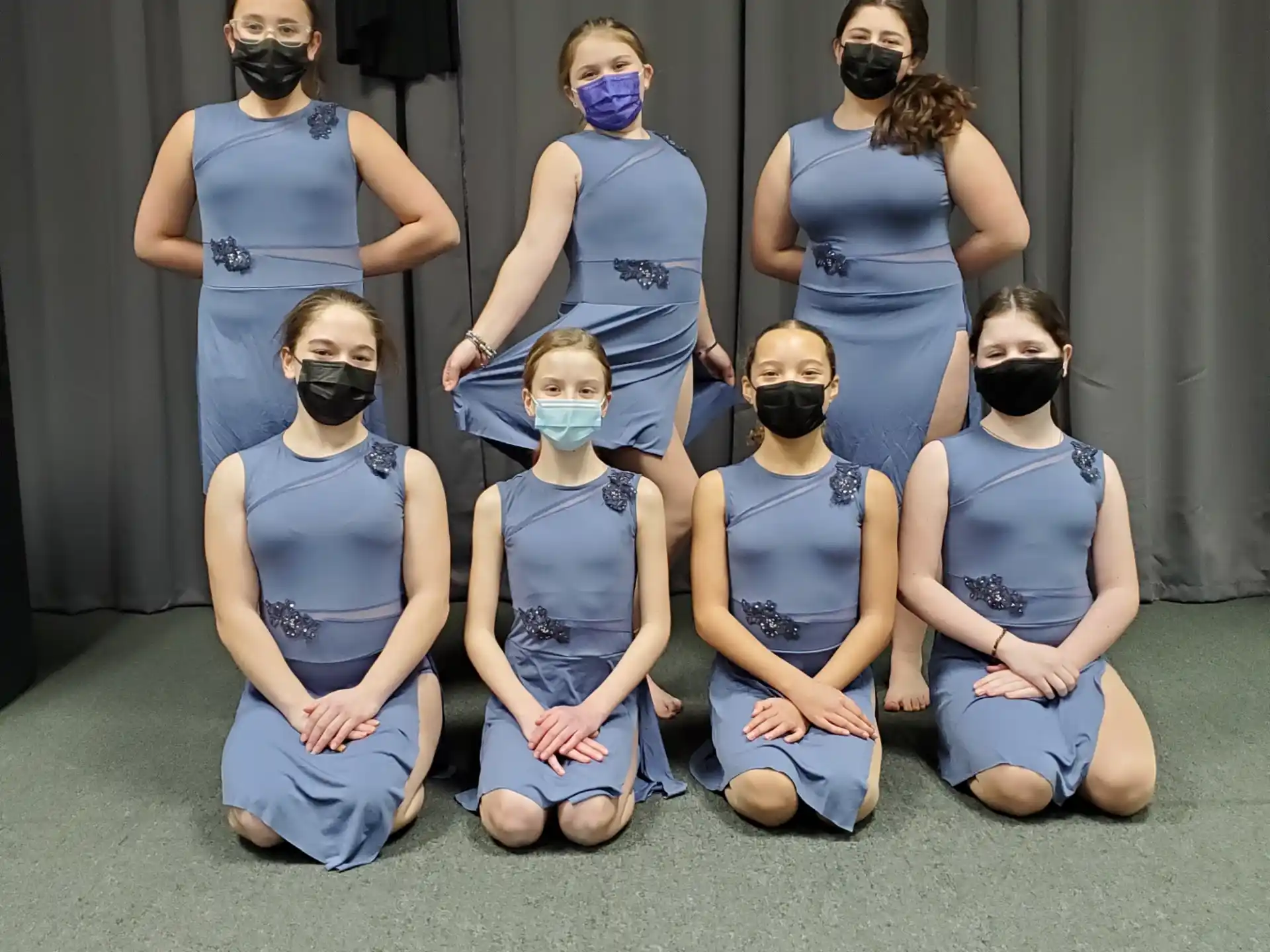 a group of people wearing masks