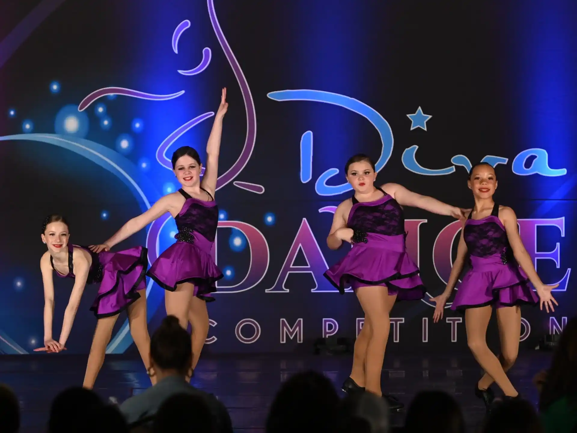 a group of women dancing on a stage