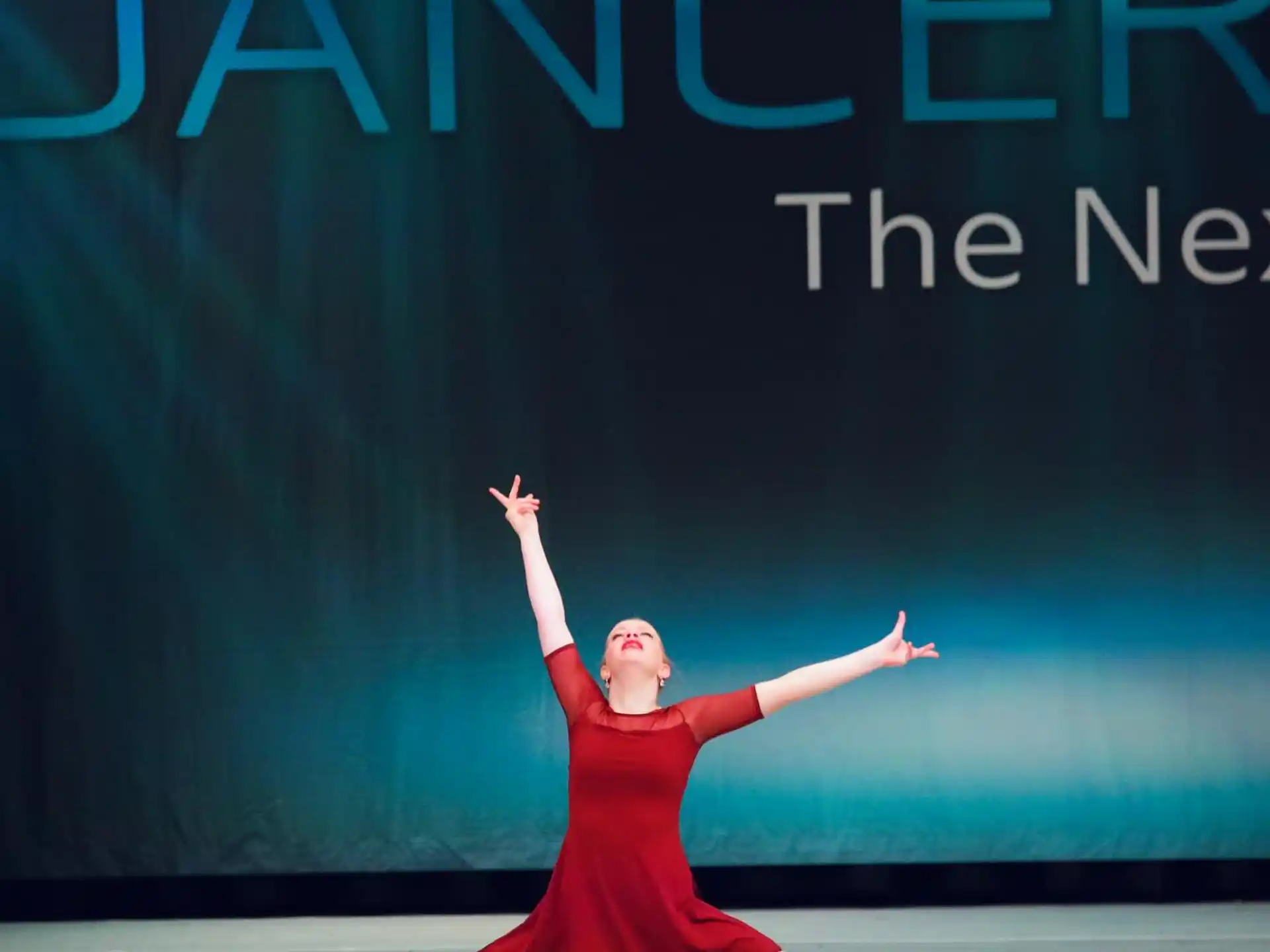 a woman dancing on a stage