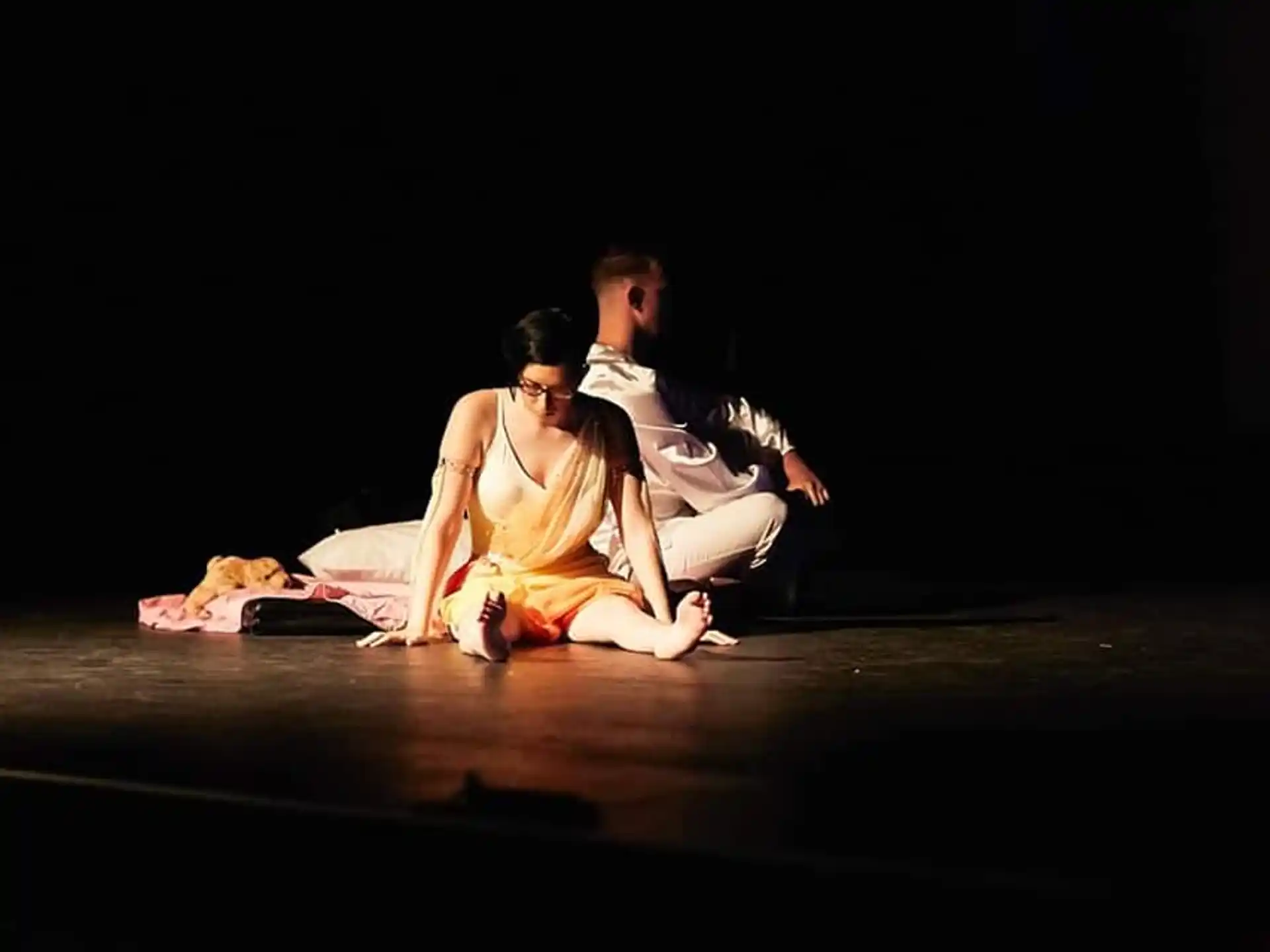 a man and woman sitting on the floor