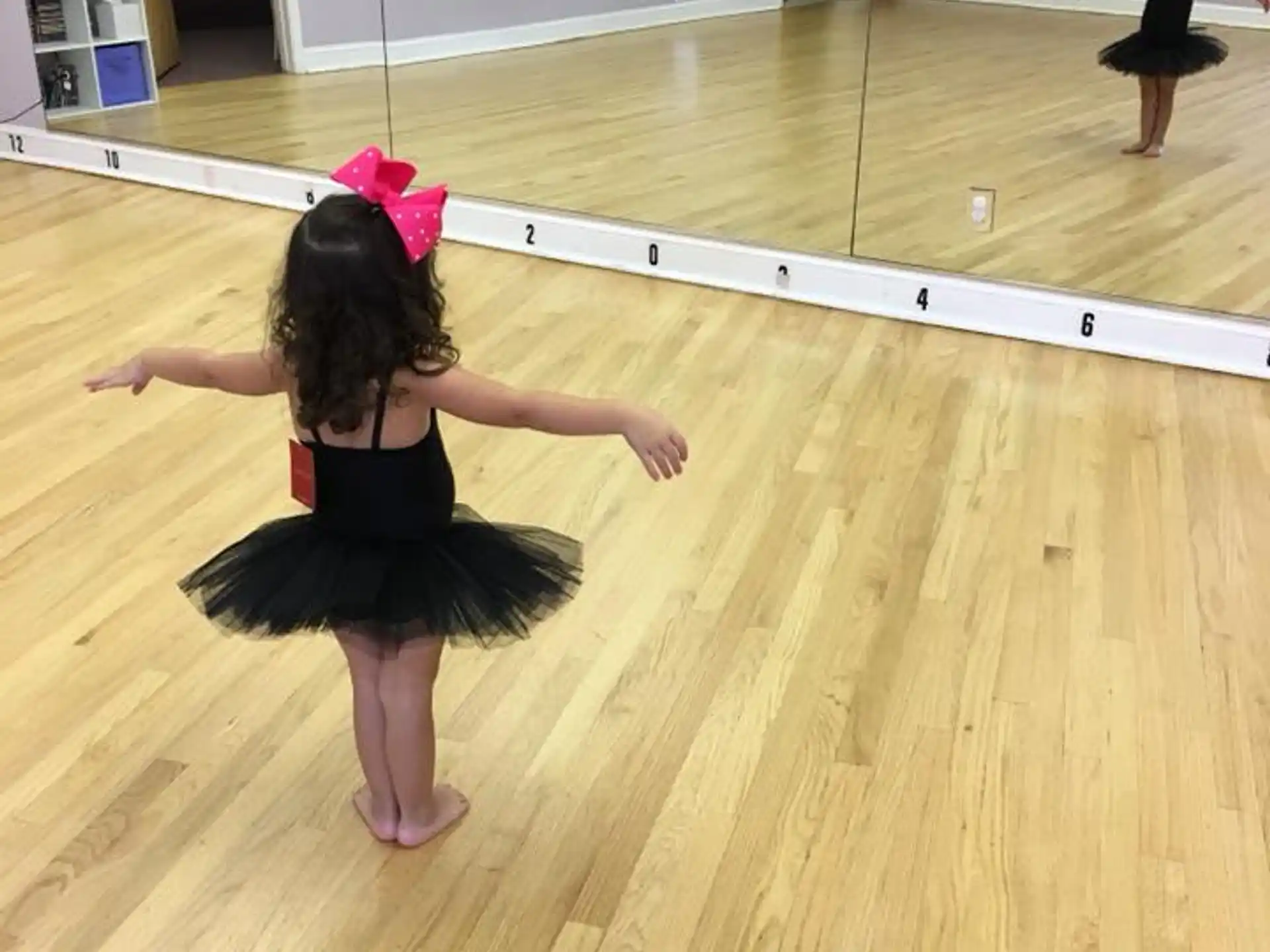 a person dancing on a wood floor