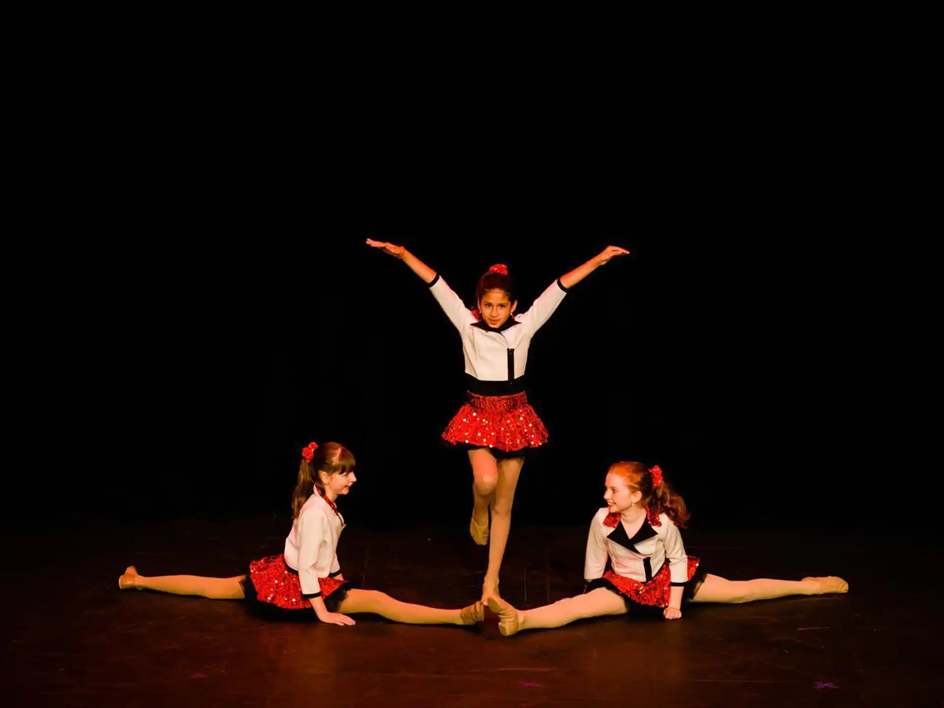 a group of women dancing on a stage