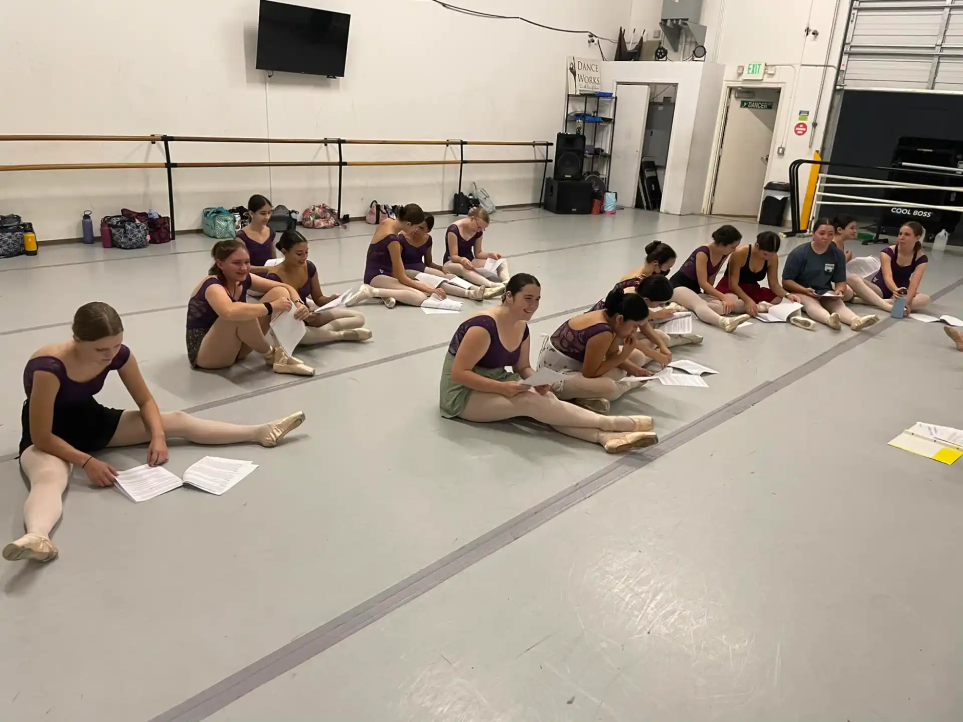 a group of people sitting on the floor