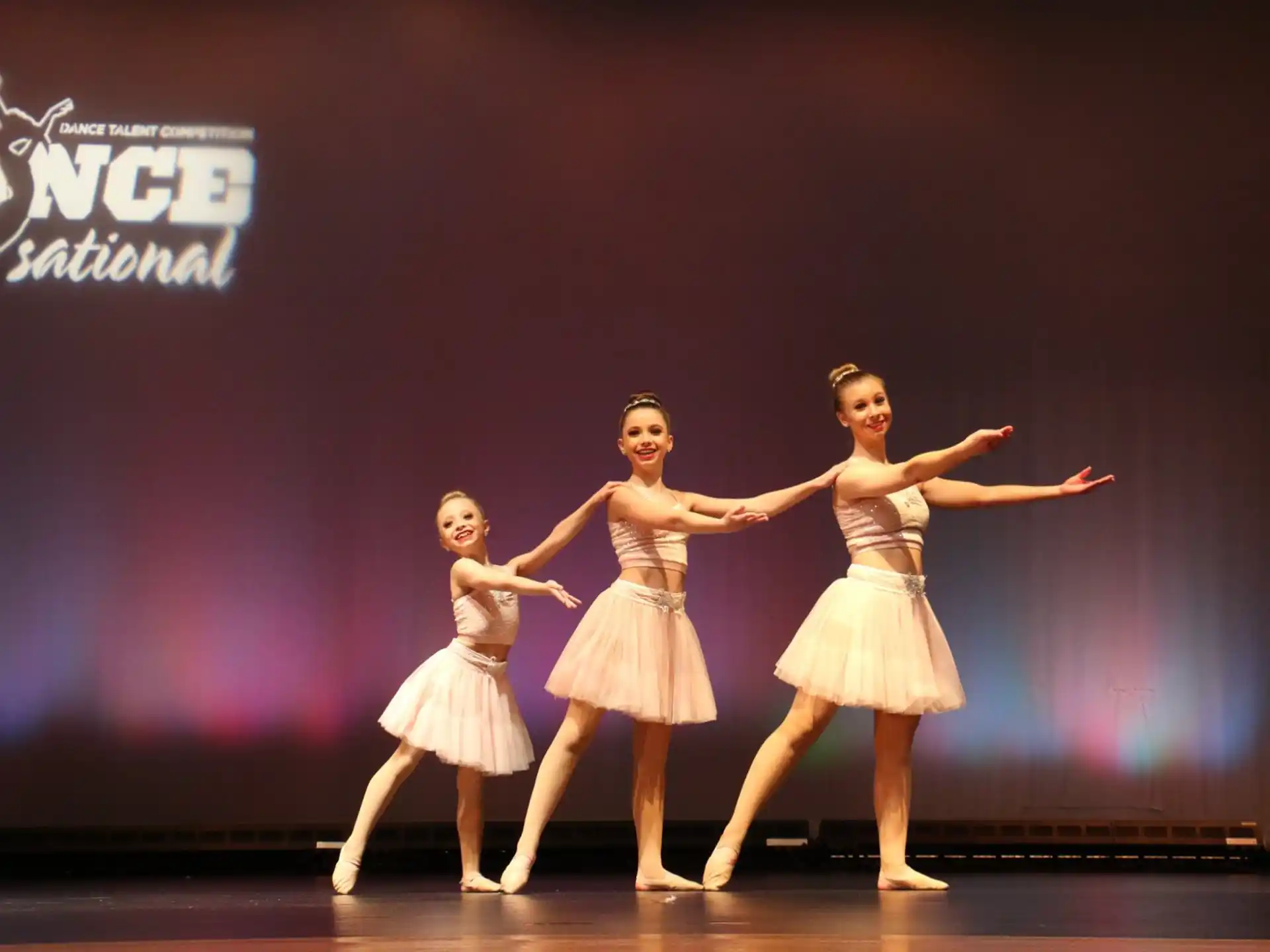 a group of women dancing on a stage