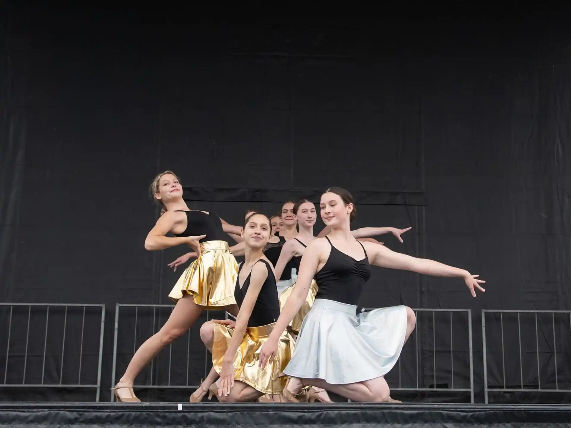 a group of women dancing on a stage