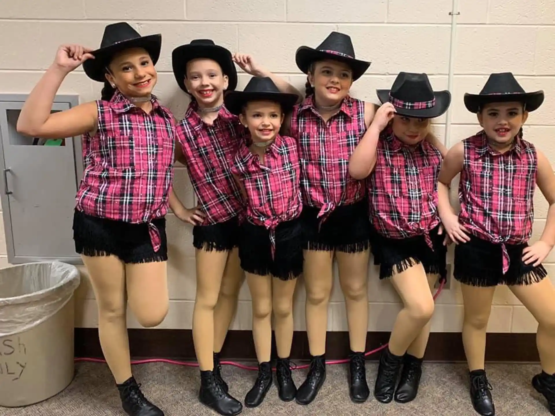a group of children wearing hats
