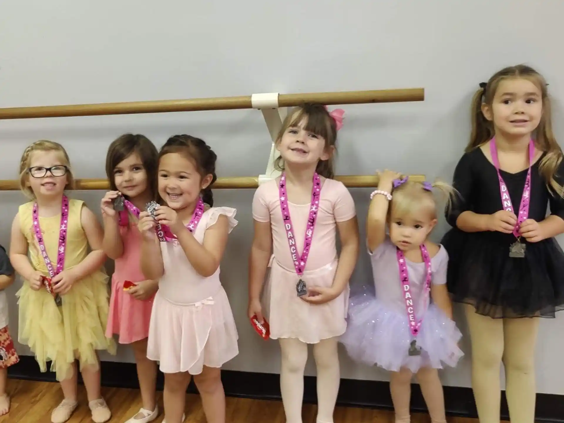 a group of girls posing for a photo