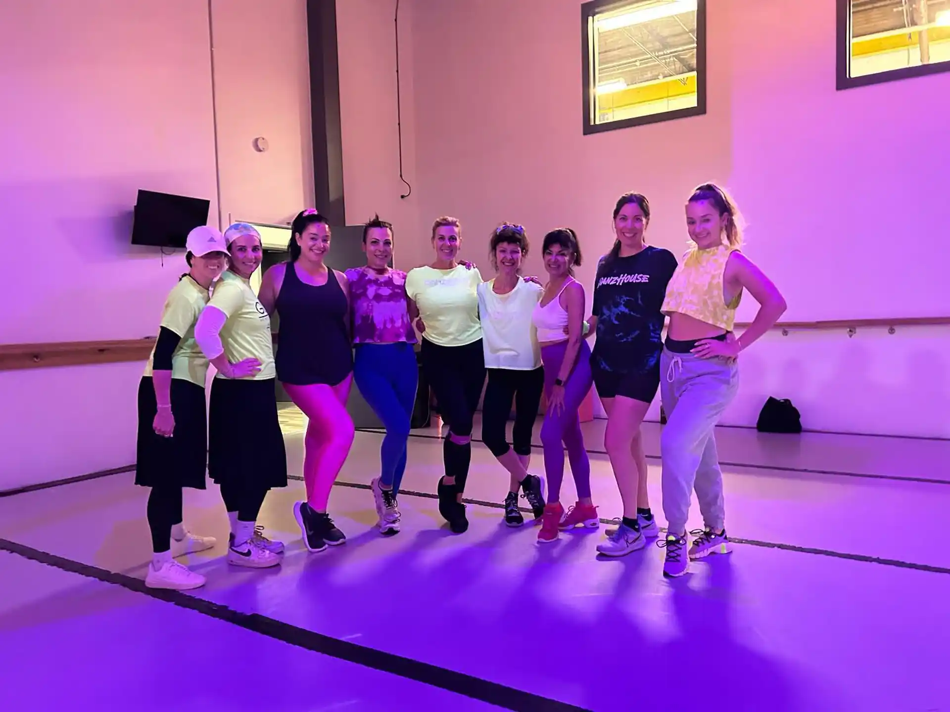 a group of women posing for a photo