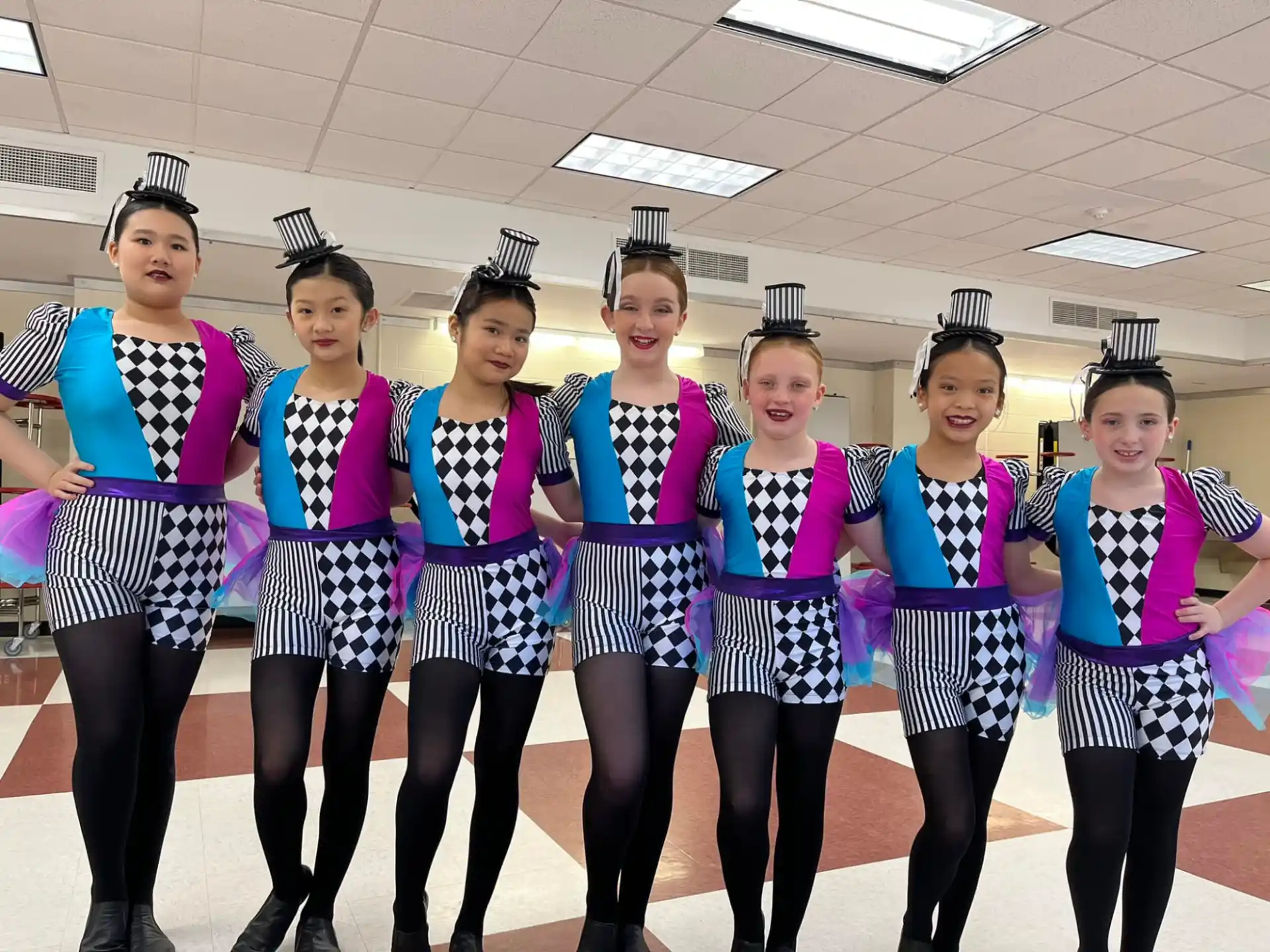 a group of women wearing matching outfits