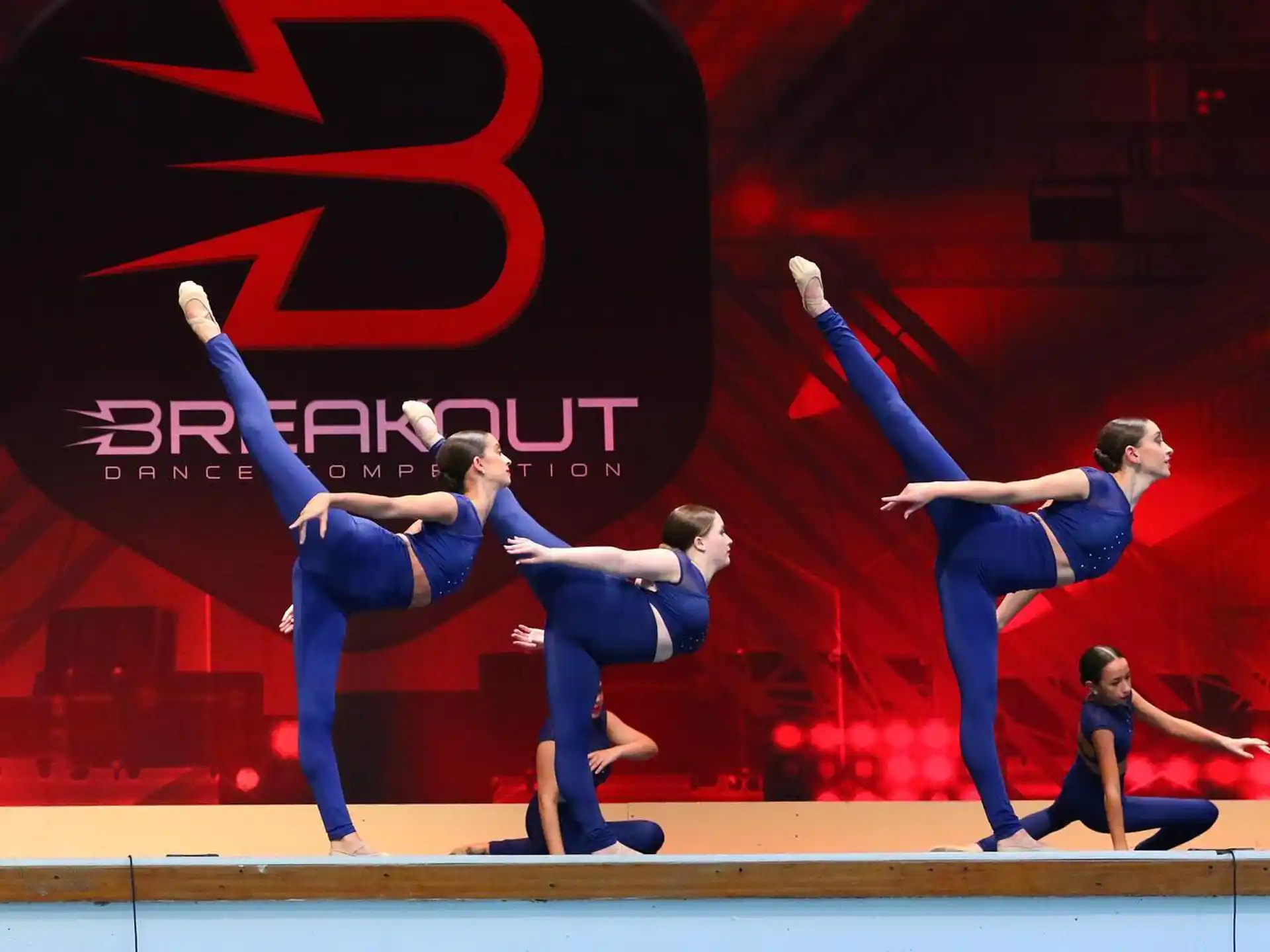a group of people dancing on a stage