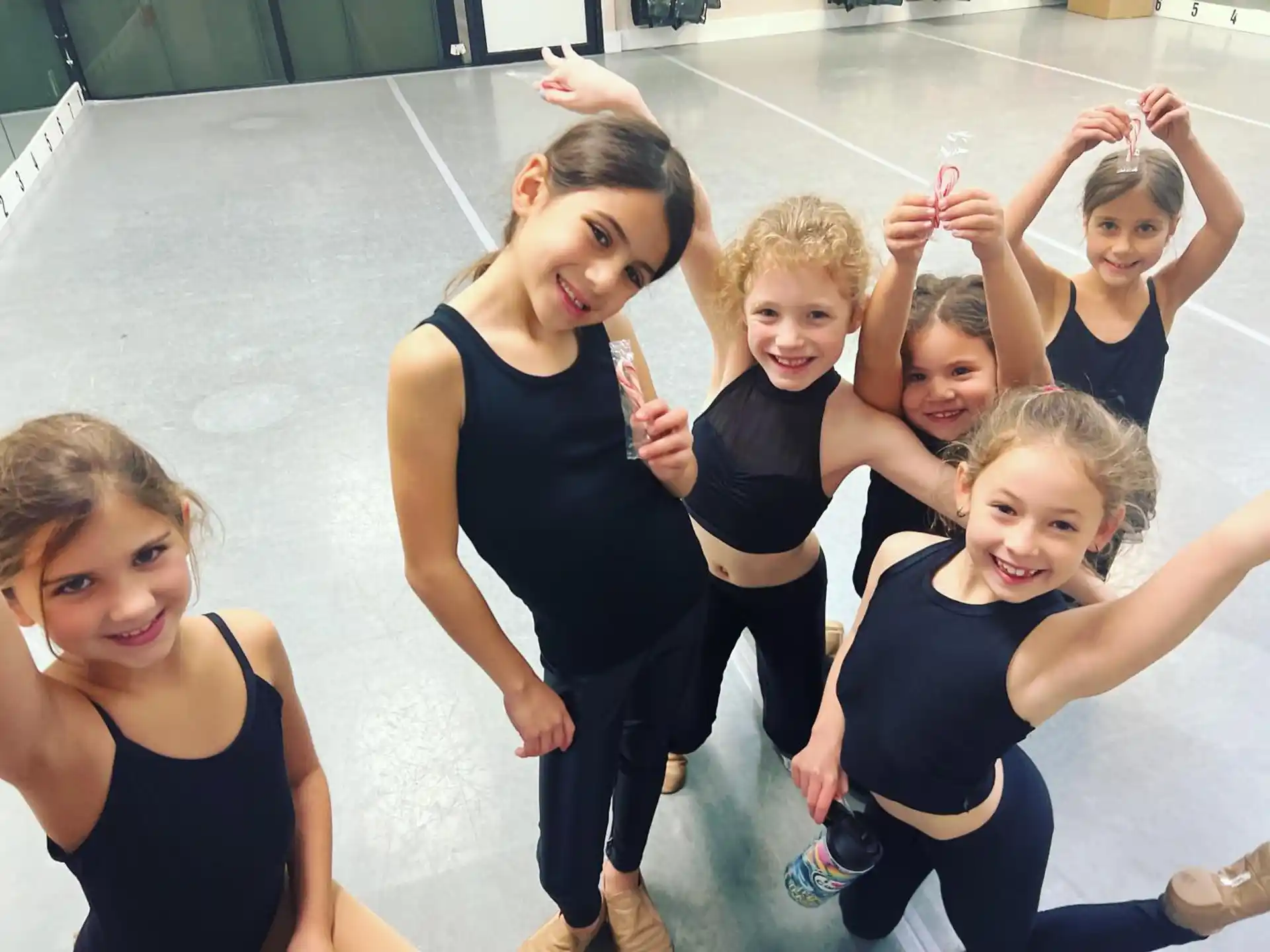 a group of girls posing for a photo