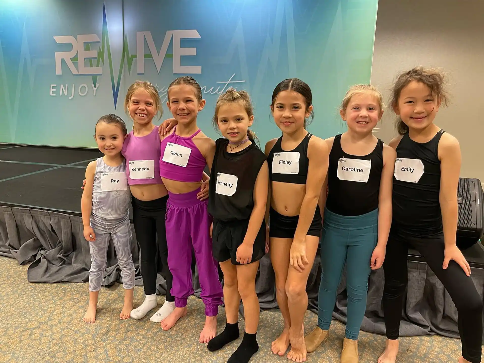 a group of girls posing for a photo