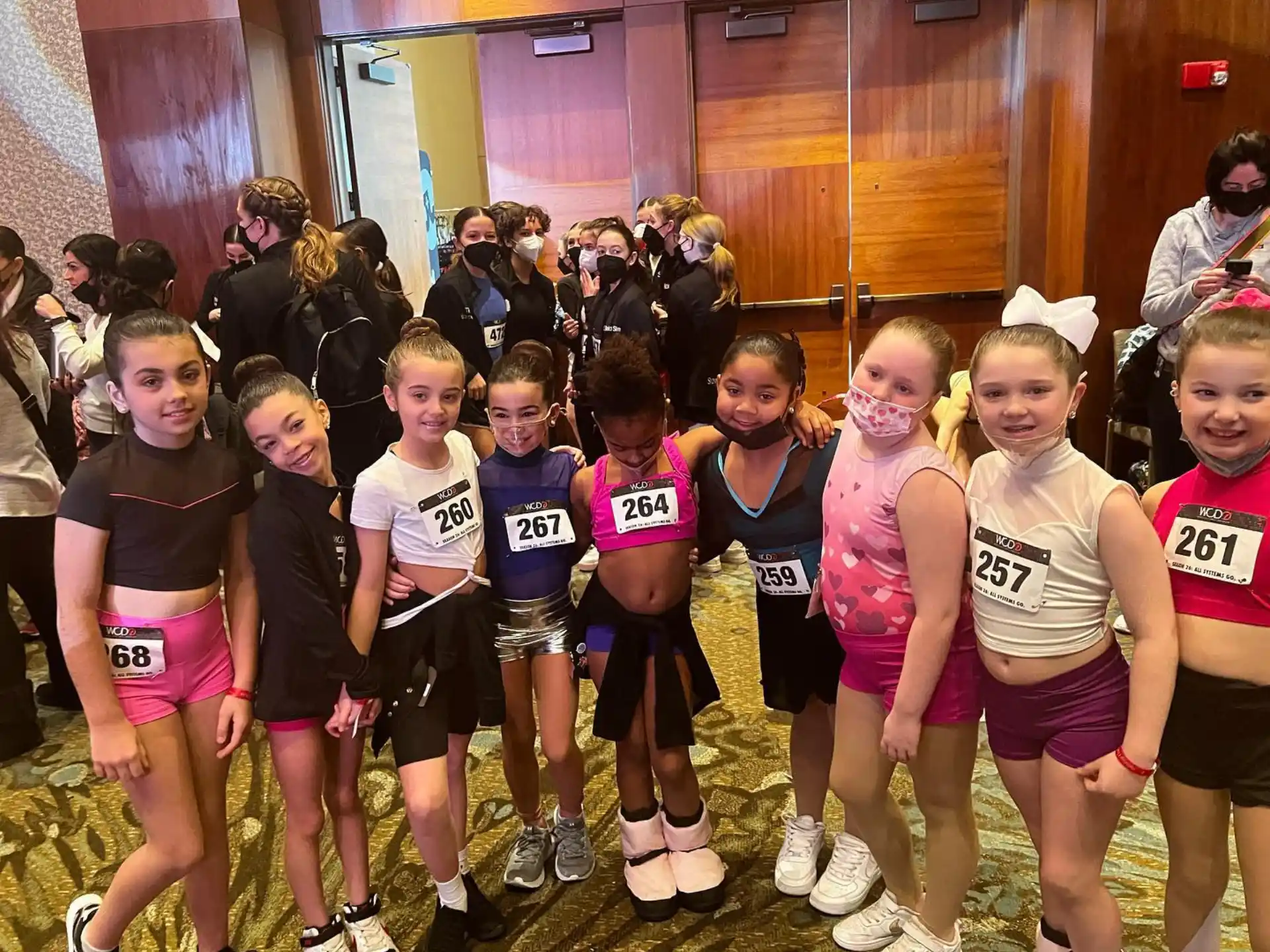 a group of girls in matching t-shirts