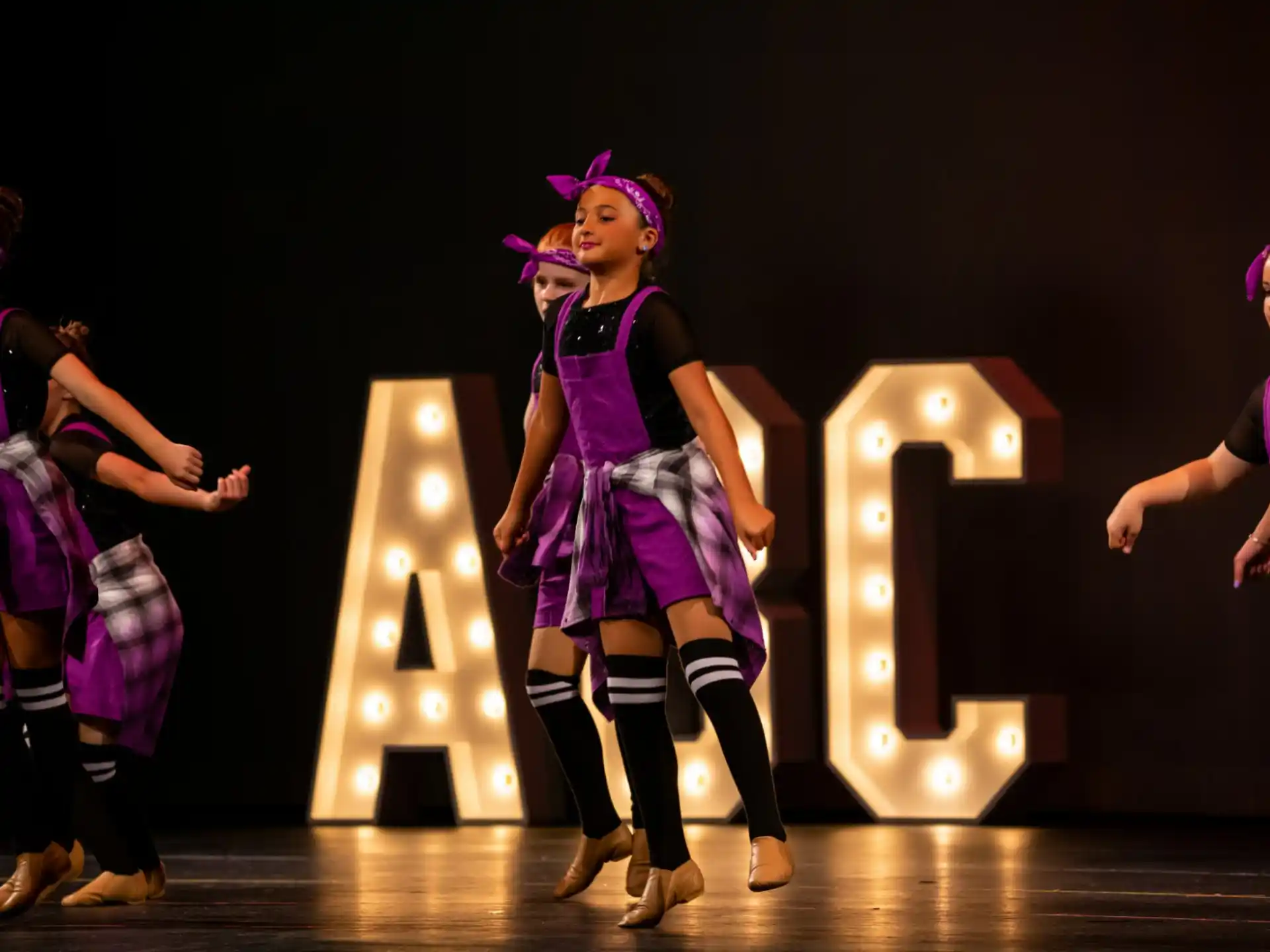 a group of women dancing on a stage