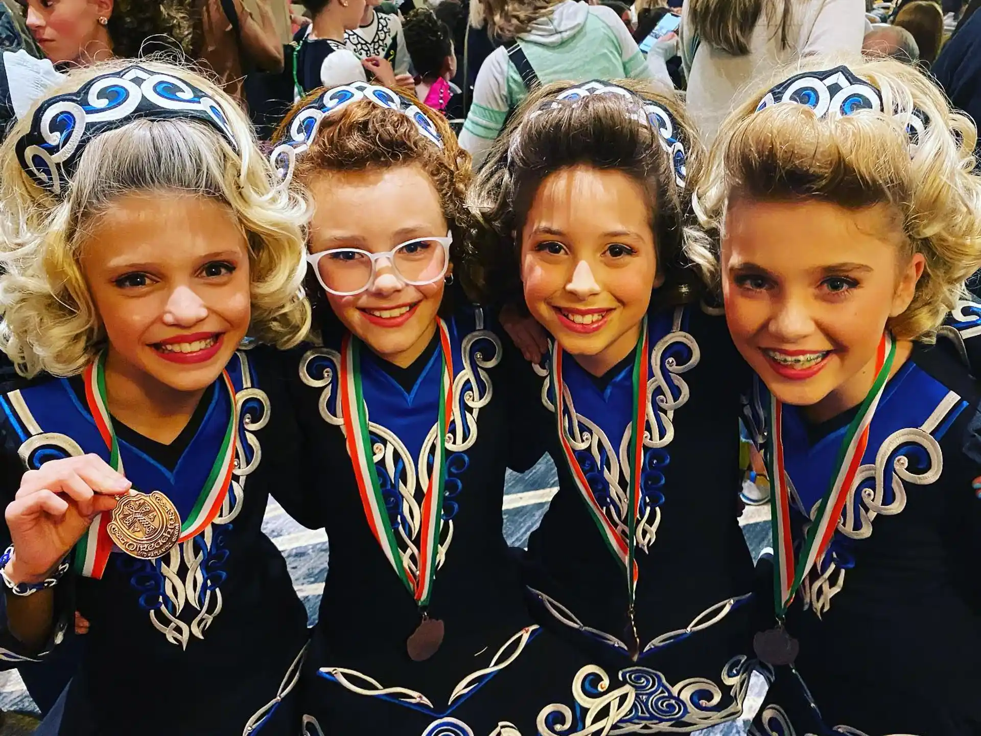 a group of girls wearing medals