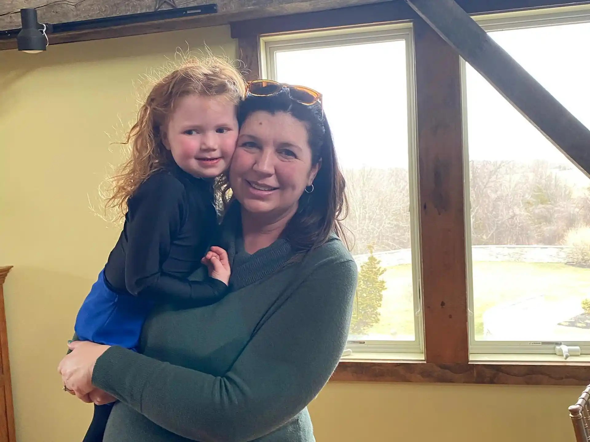 a person holding a child