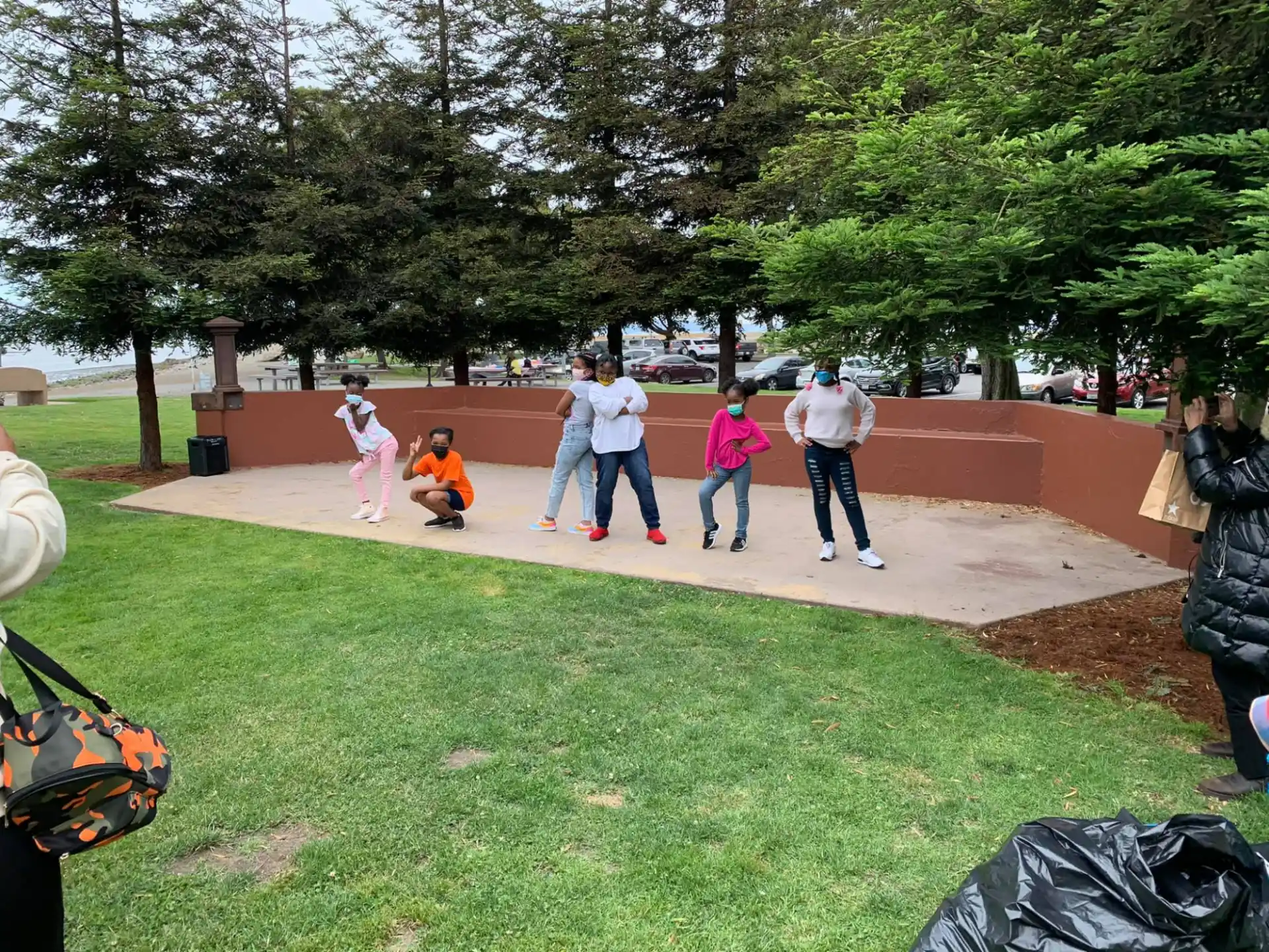 a group of people playing in a park