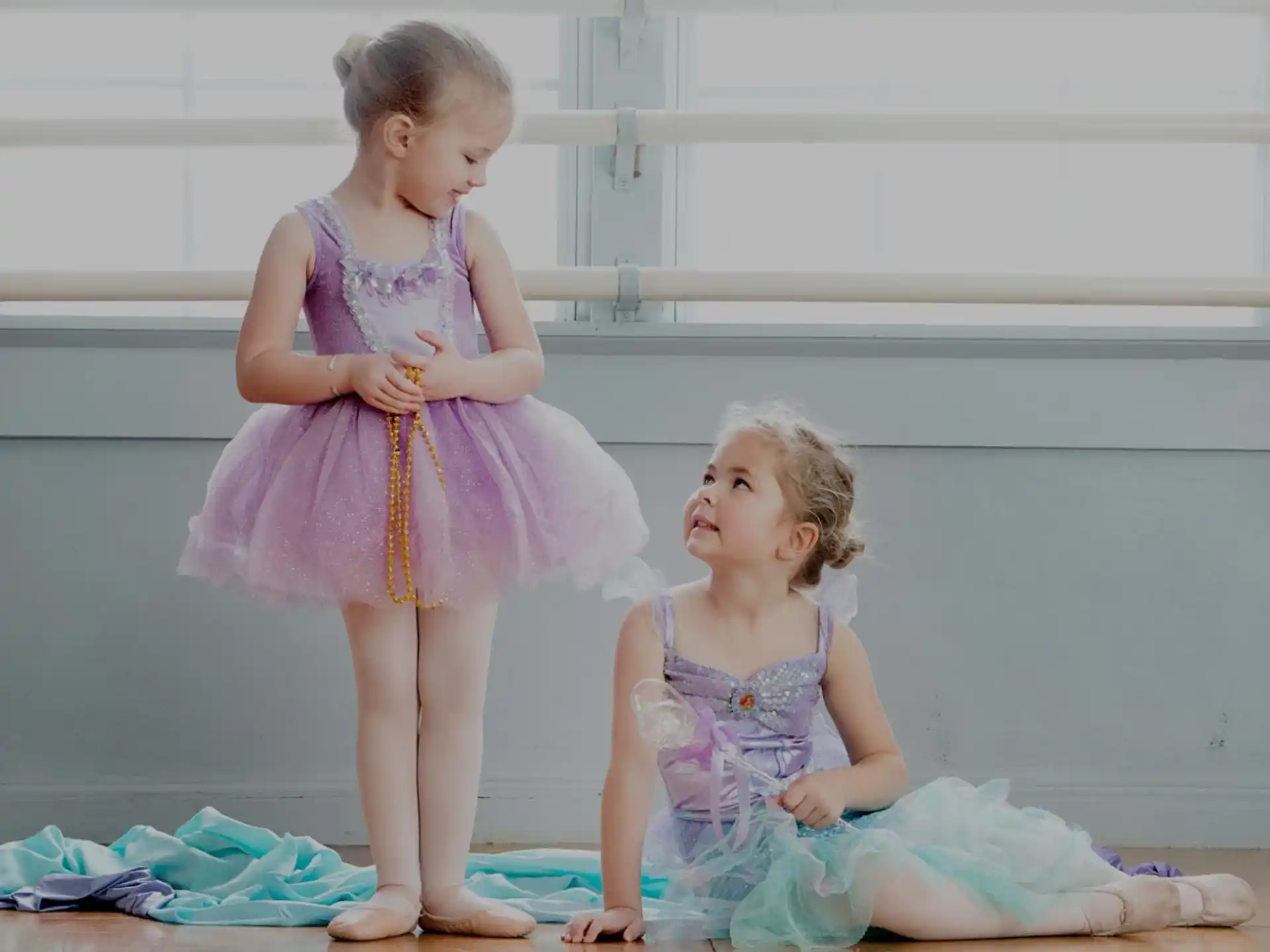 two girls in dresses