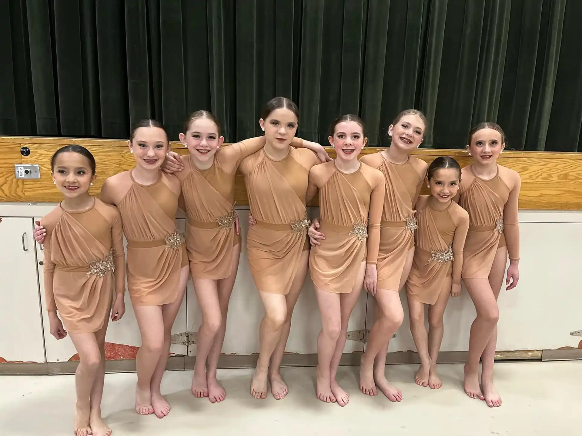 a group of children in matching outfits