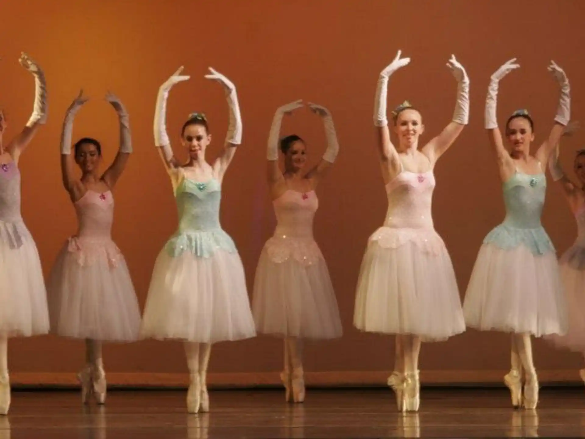 a group of women in dresses