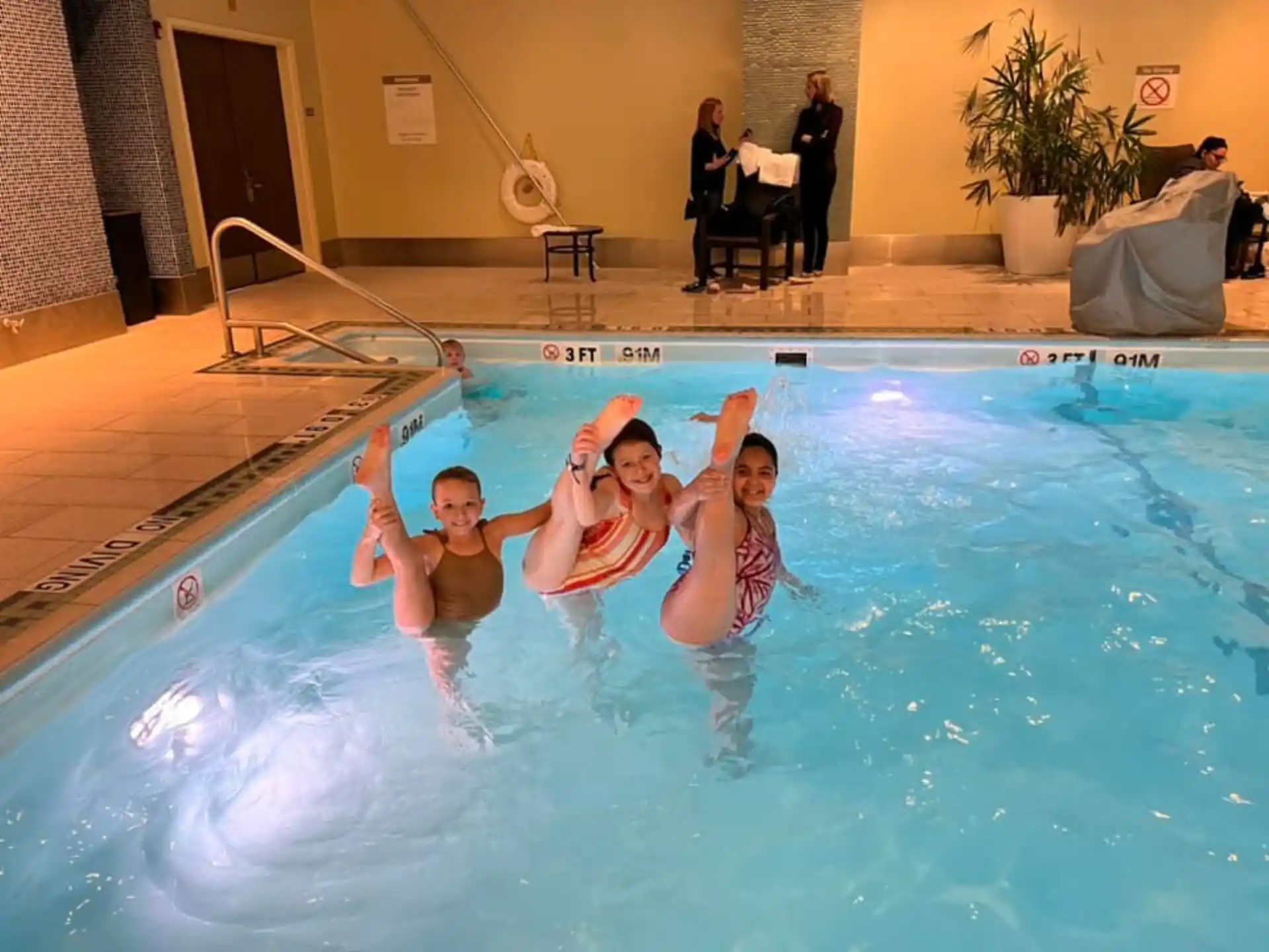 a group of people in a swimming pool