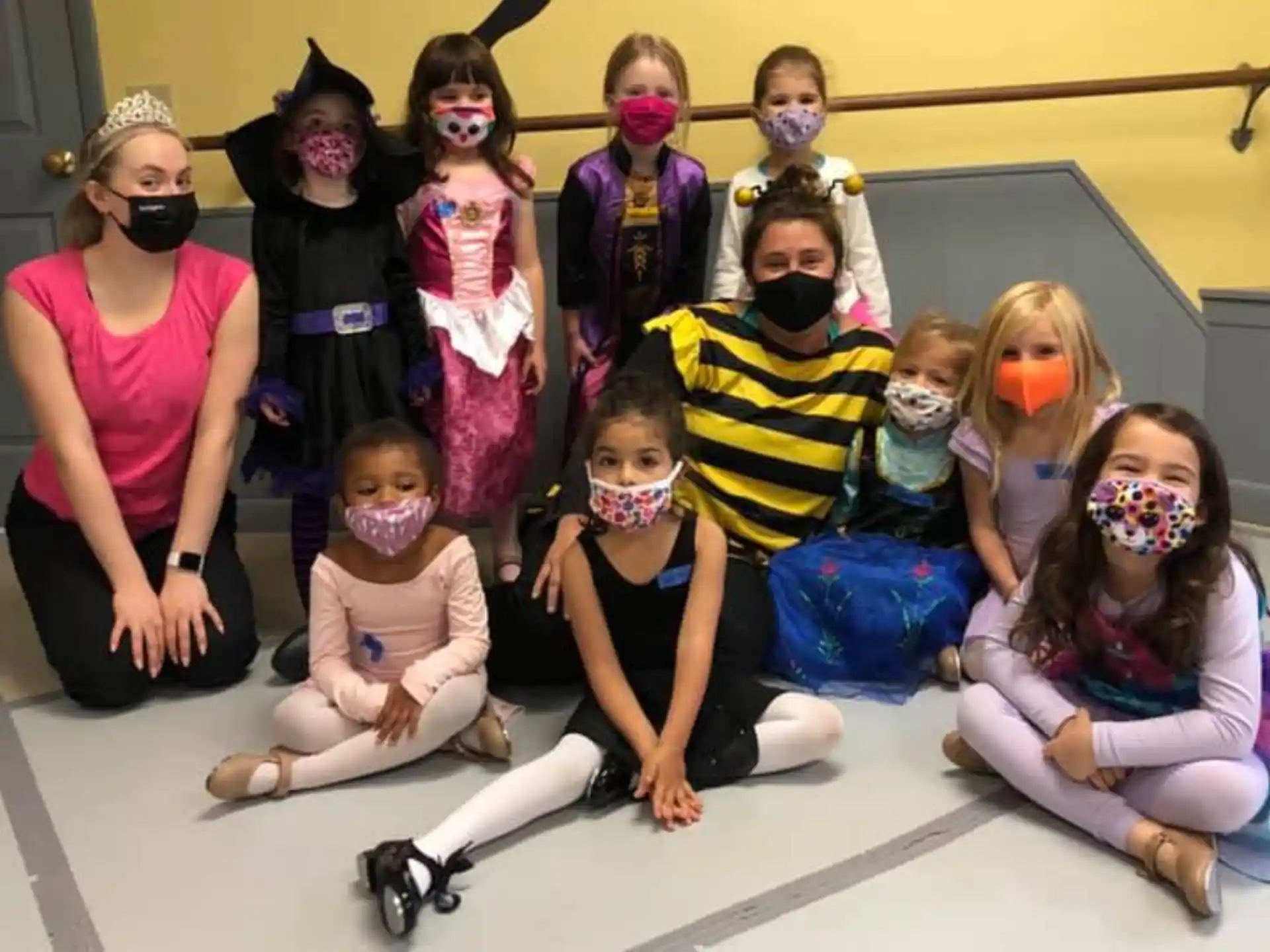 a group of people wearing masks