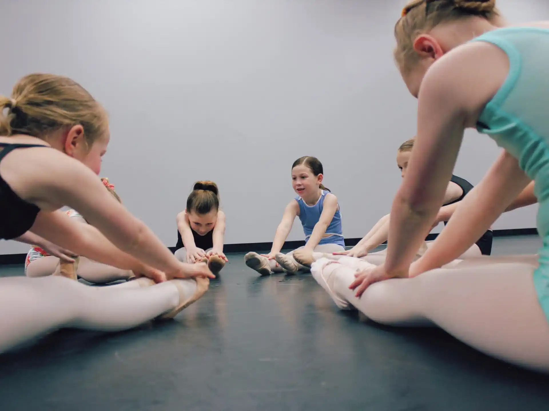 a group of people sitting on the floor