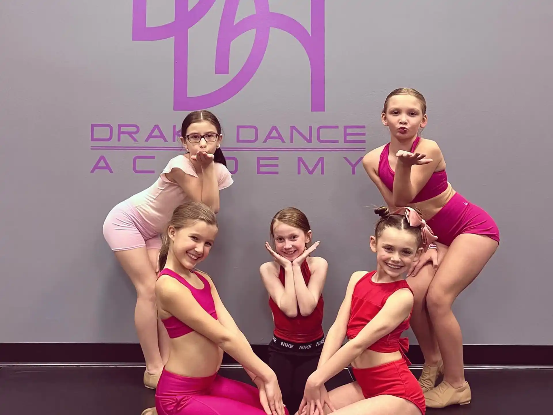 a group of women posing for a photo