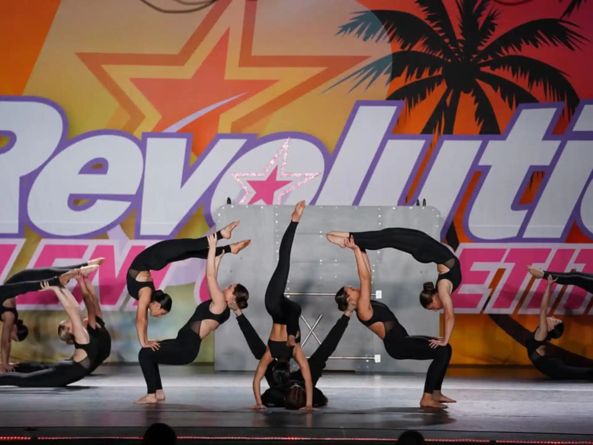 a group of people dancing on a stage