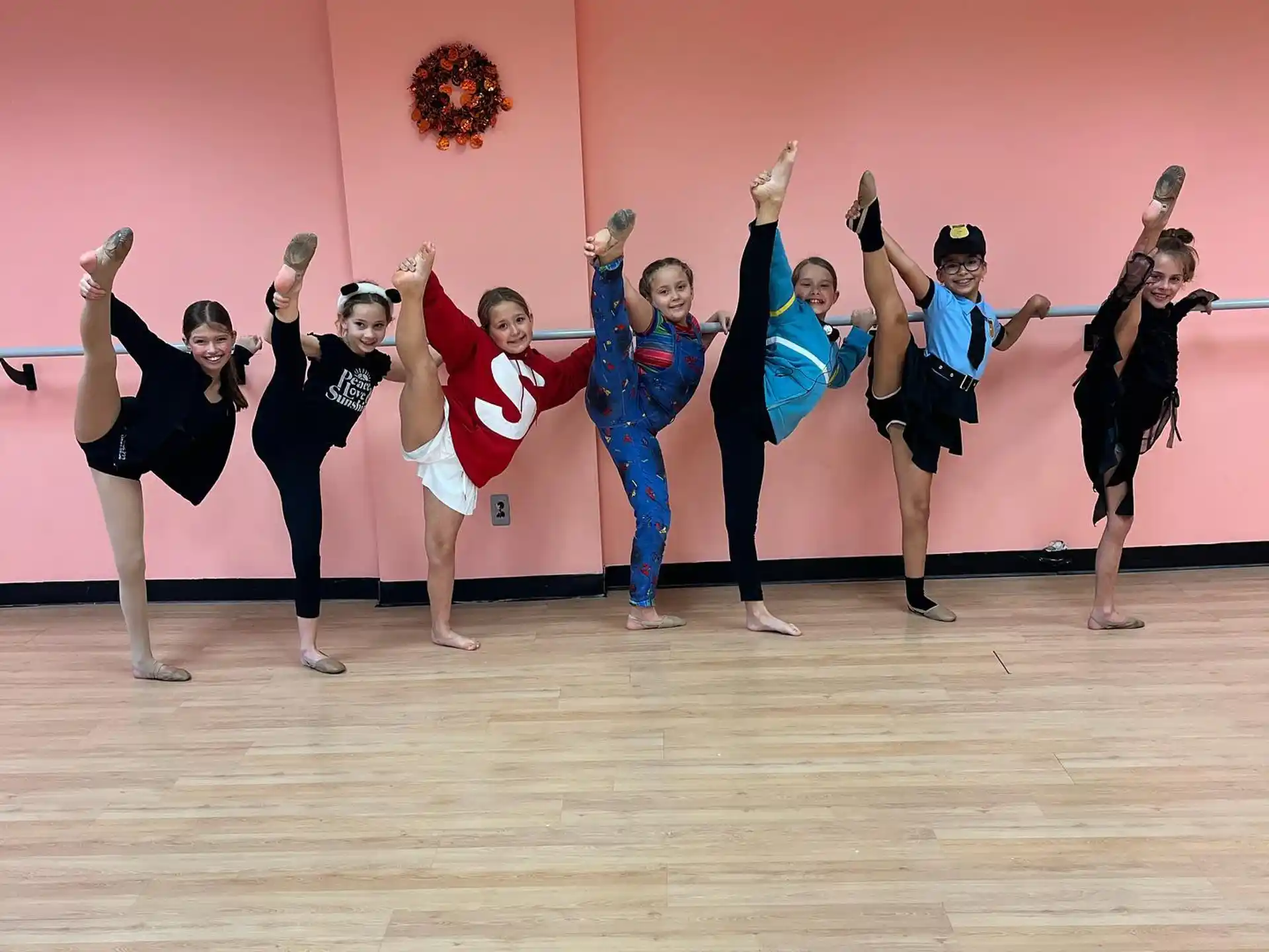 a group of people in clothing jumping in the air