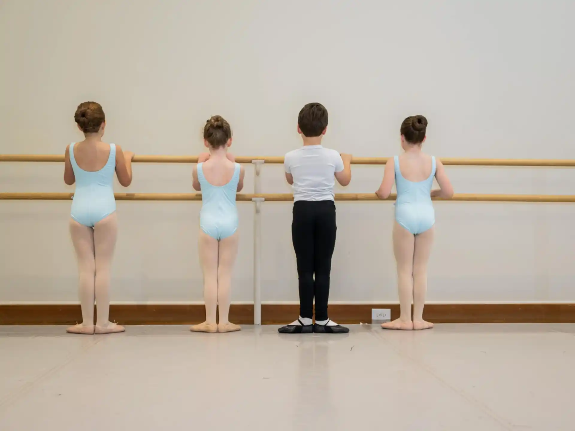 a group of people standing in front of a railing