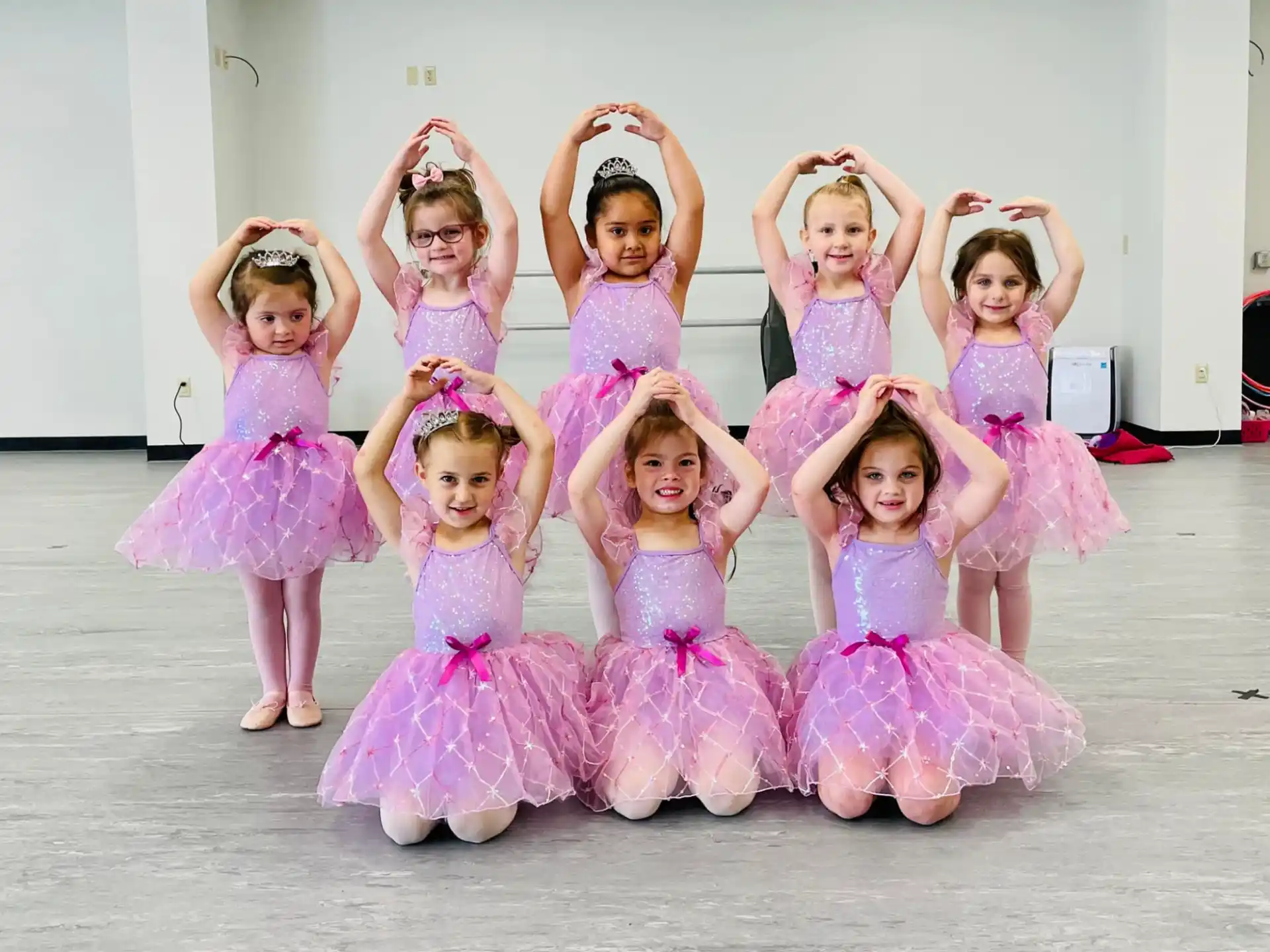 a group of girls in dresses