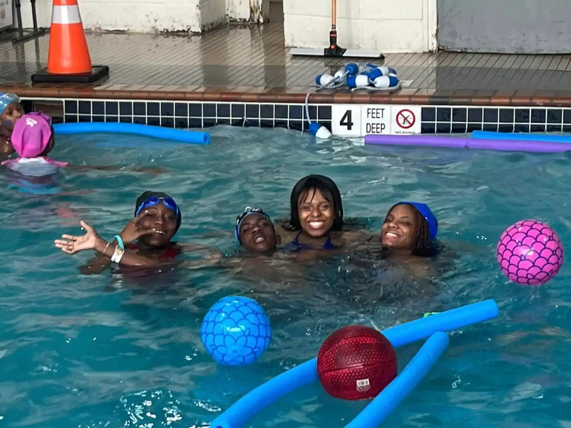 a group of people in a pool