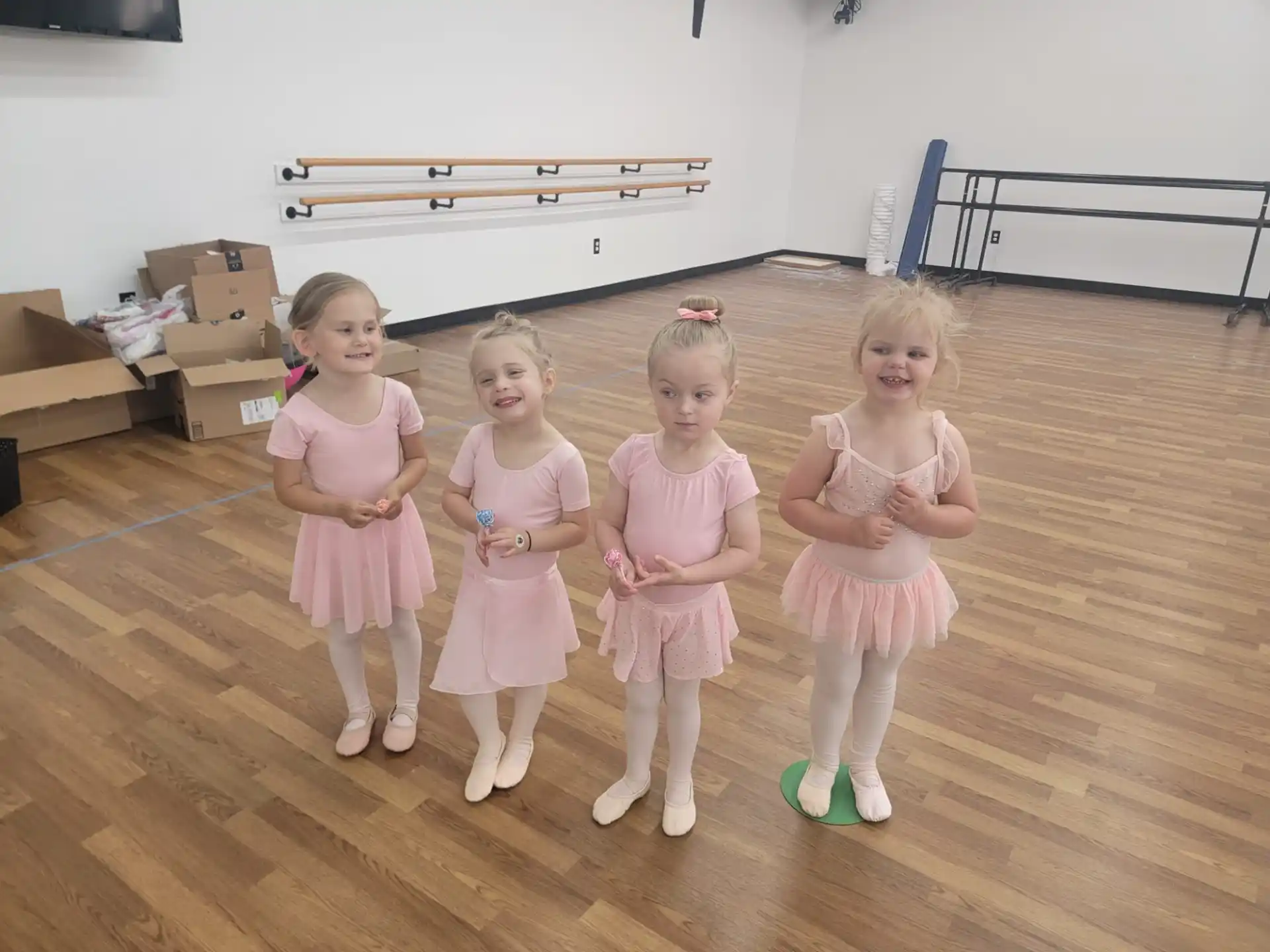 a group of girls in dresses