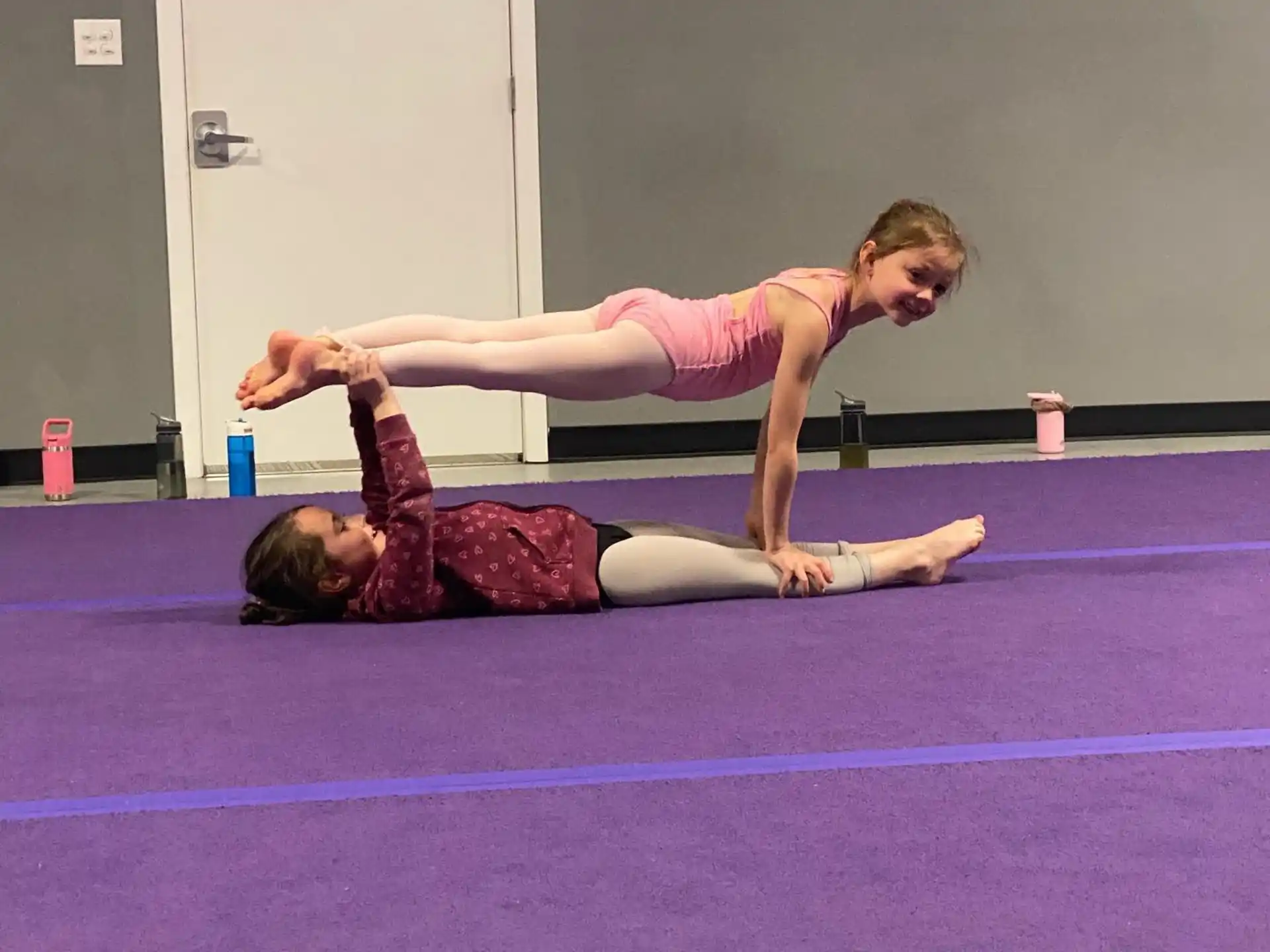 a couple of women doing yoga