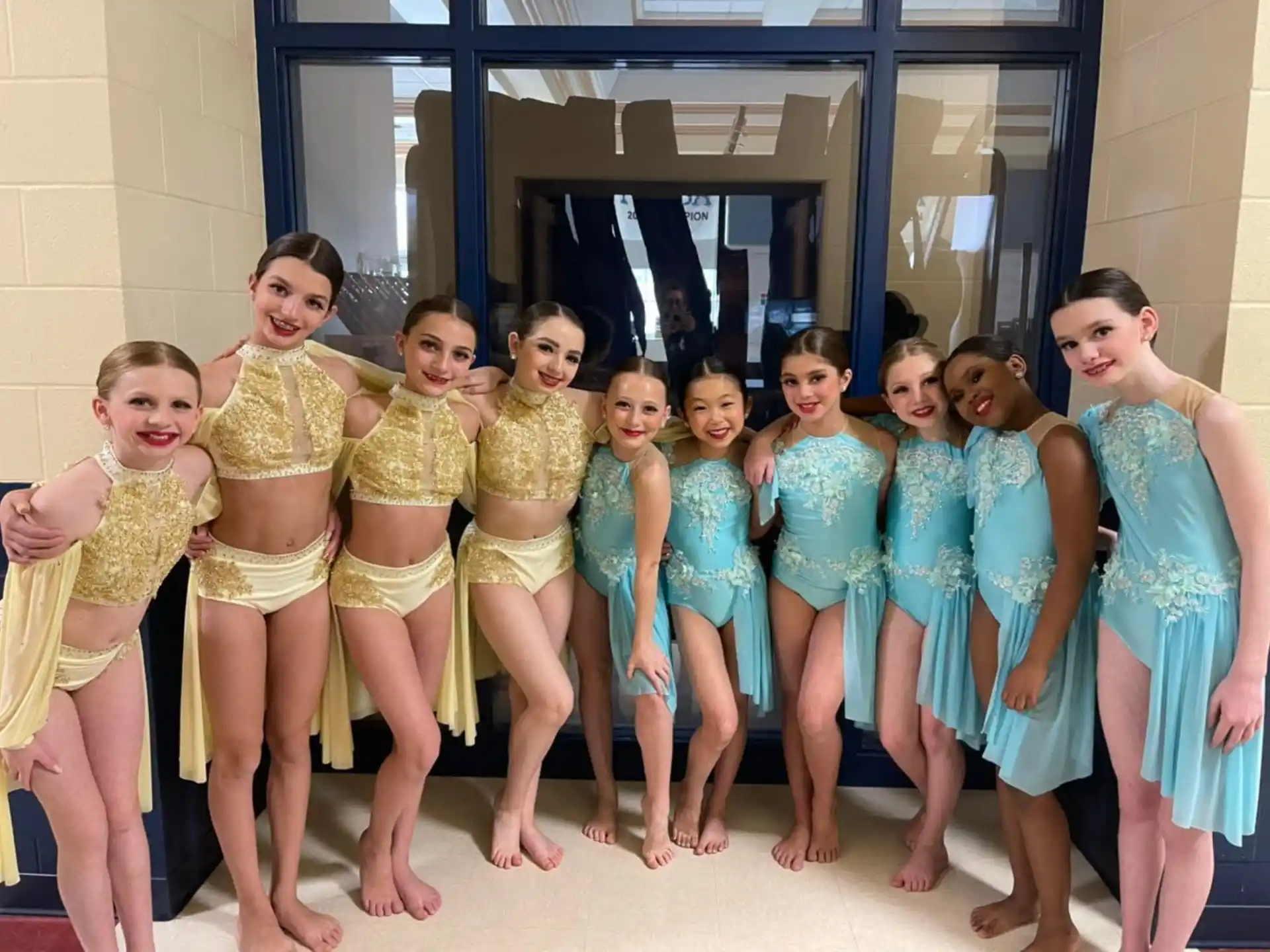 a group of girls in matching outfits