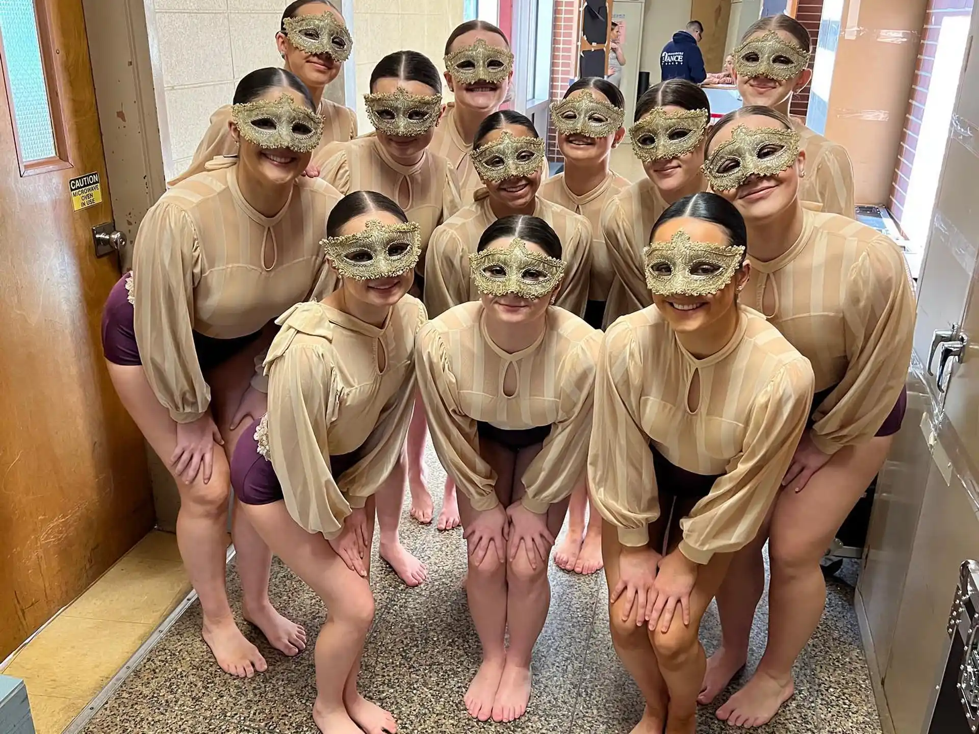 a group of people wearing masks