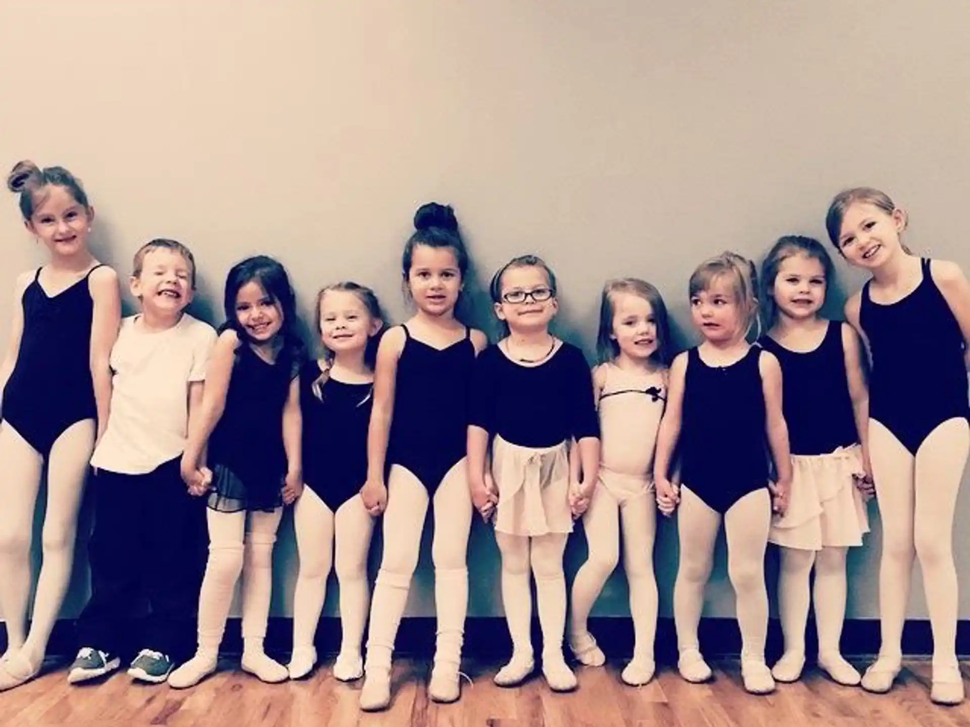 a group of girls posing for a photo