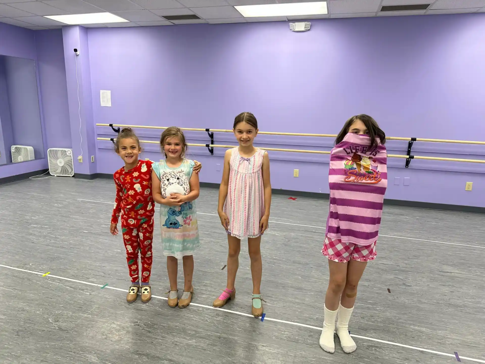 a group of girls posing for a photo