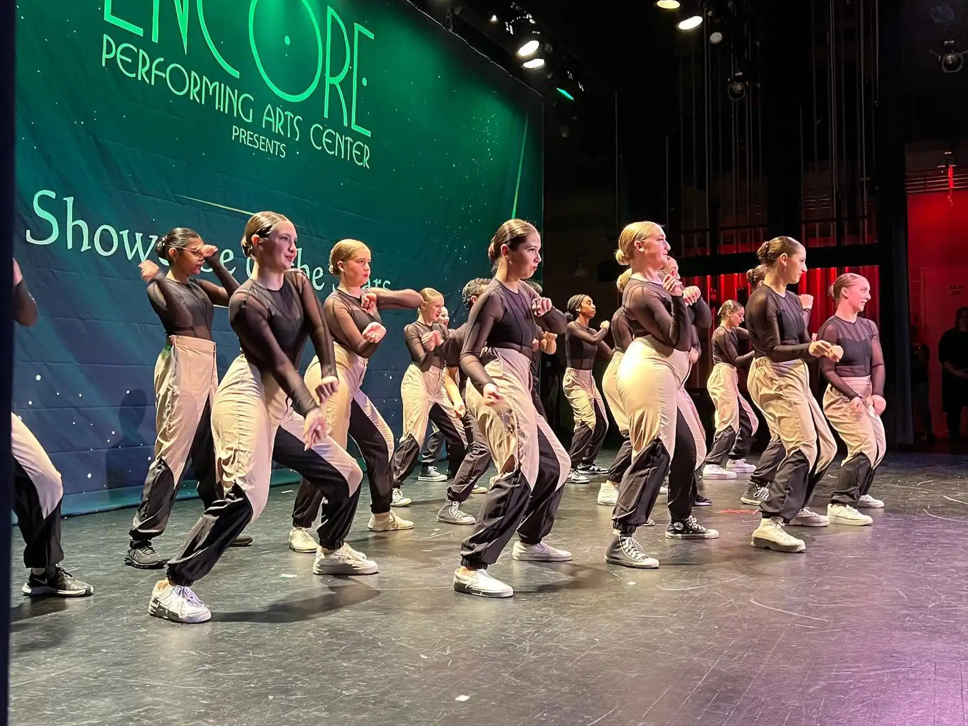 a group of people dancing on a stage