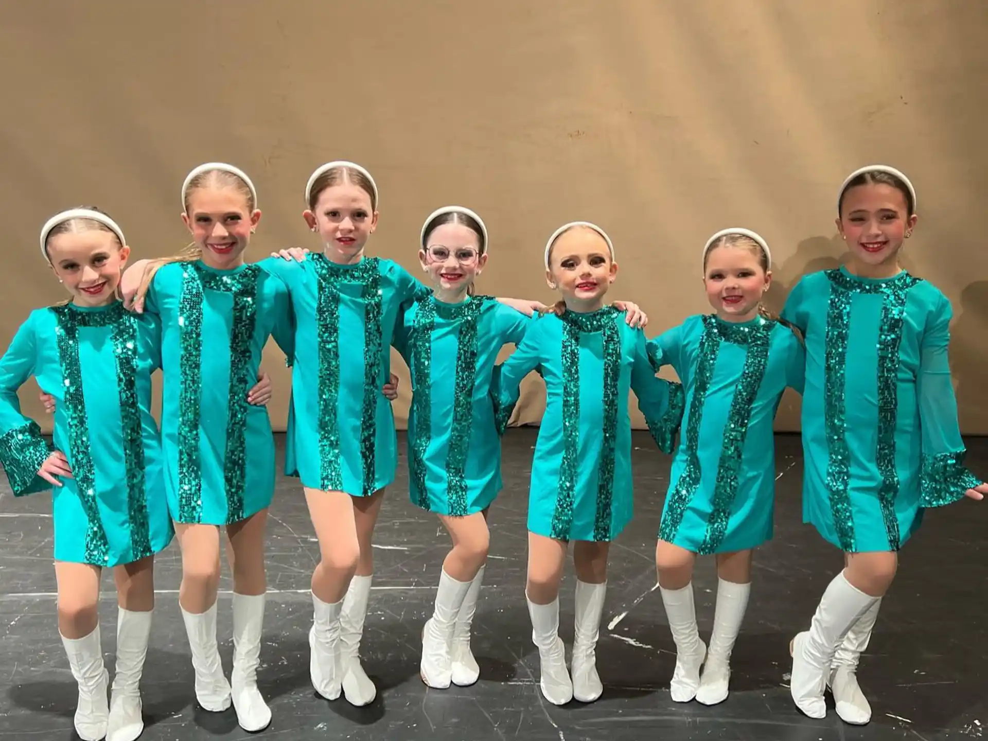 a group of girls in blue uniforms