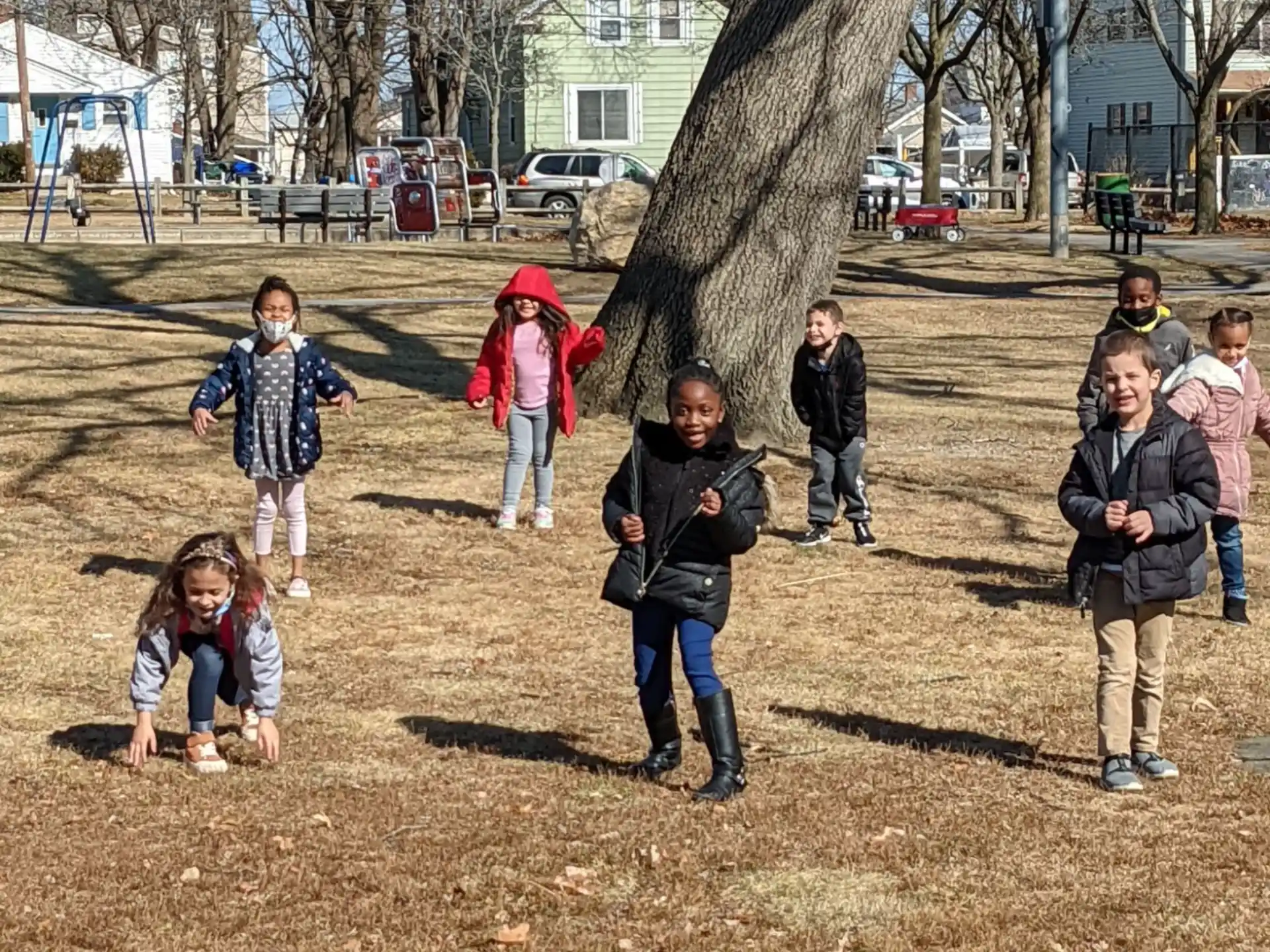 a group of children playing in a field