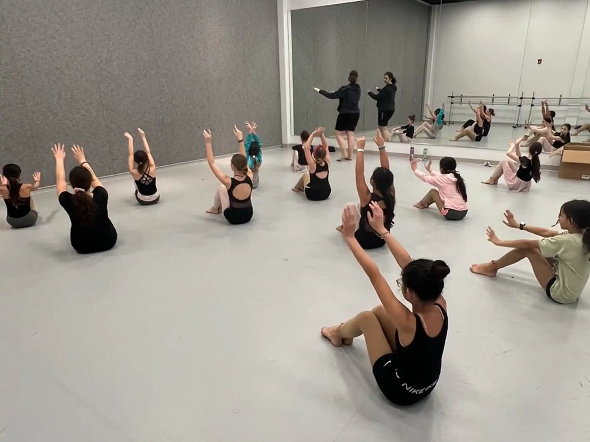 a group of people sitting on the floor